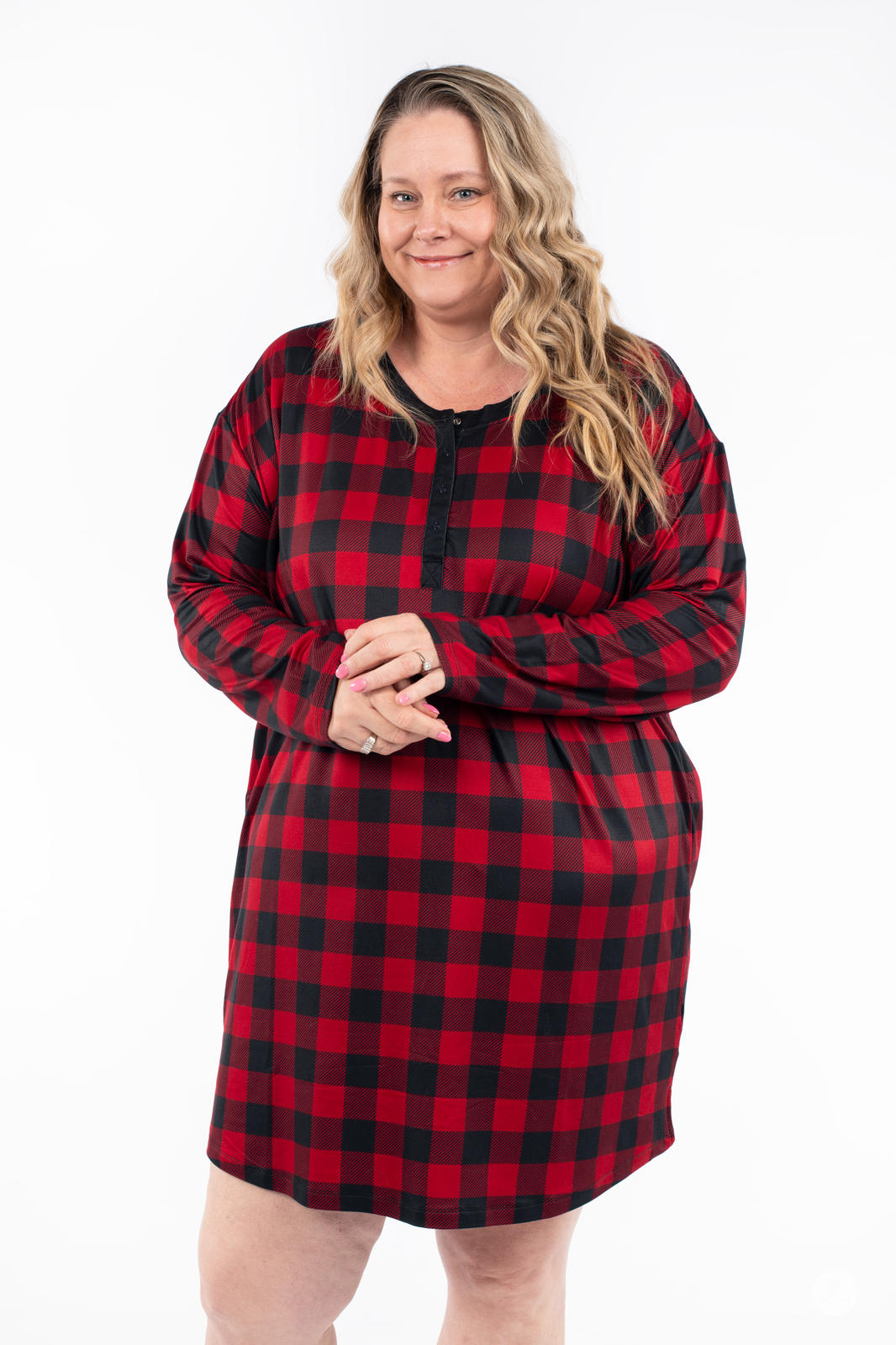 Plus size model smiling in SweetTops Henley Sleep Shirt in red and black buffalo plaid front view