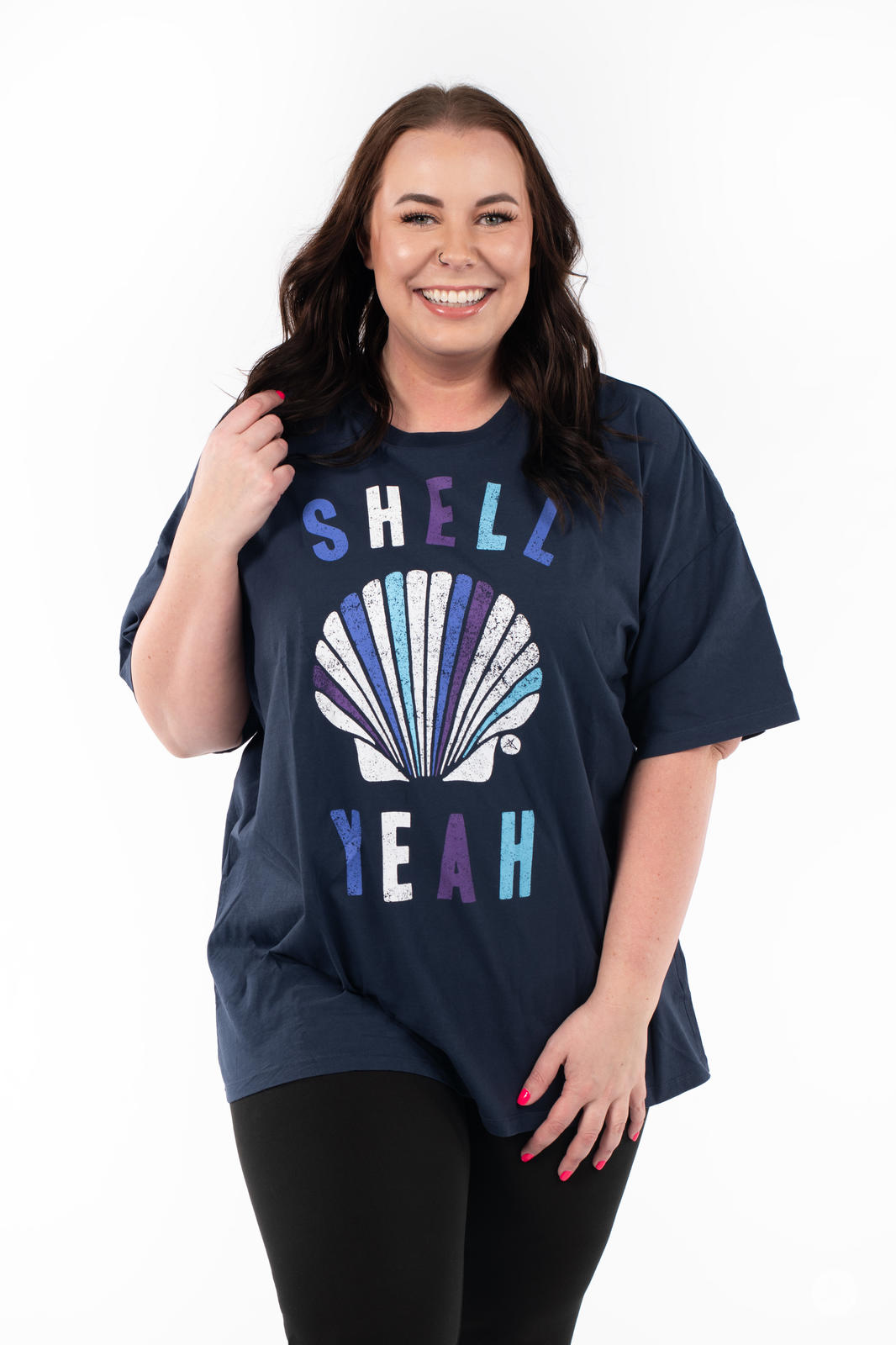 Smiling woman wearing SweetTops Vintage Graphic Tee in navy with shell design and fun affirmation text design
