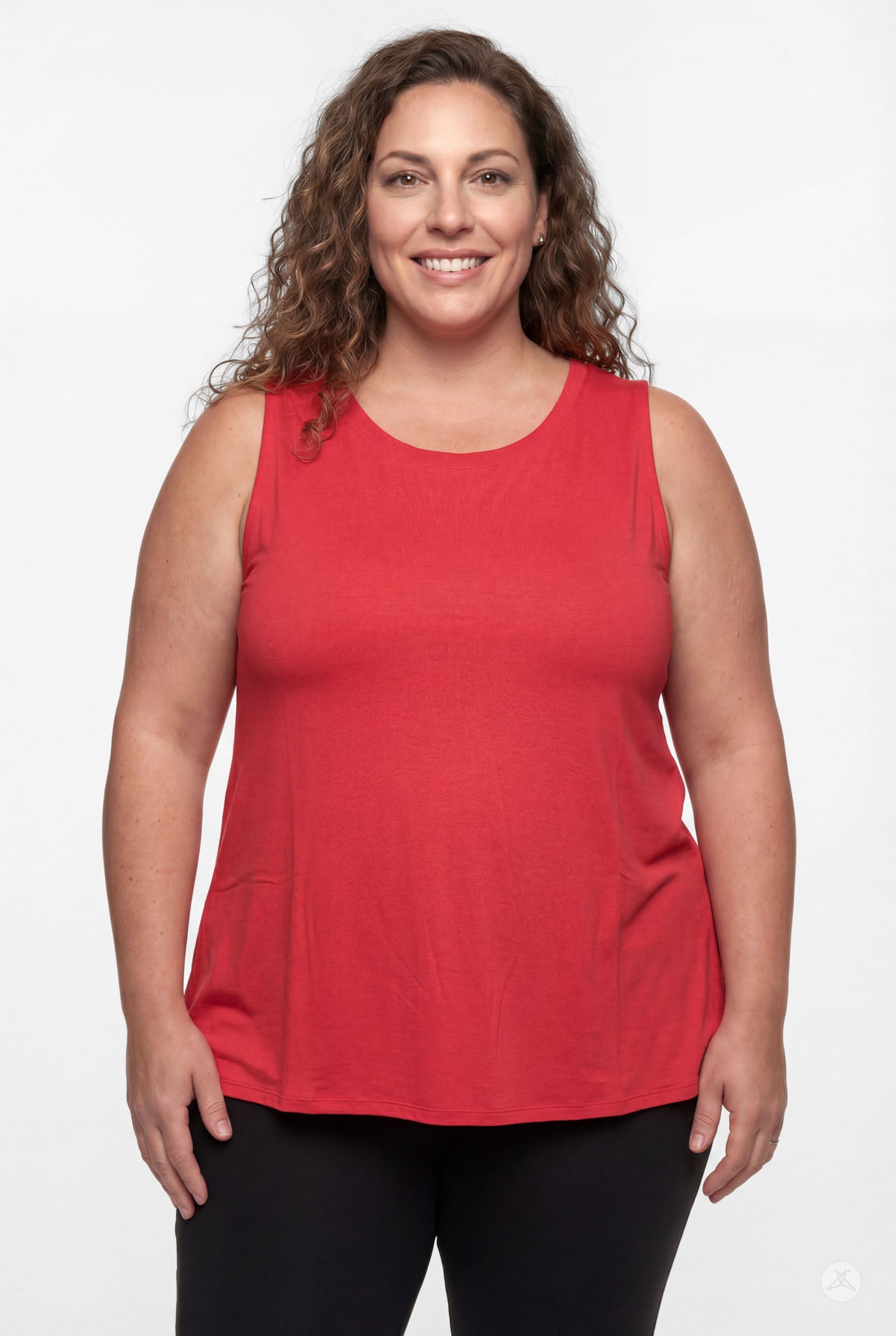 Plus size woman smiling wearing sleeveless bright red High Neck Tank by sweettops with relaxed confident pose
