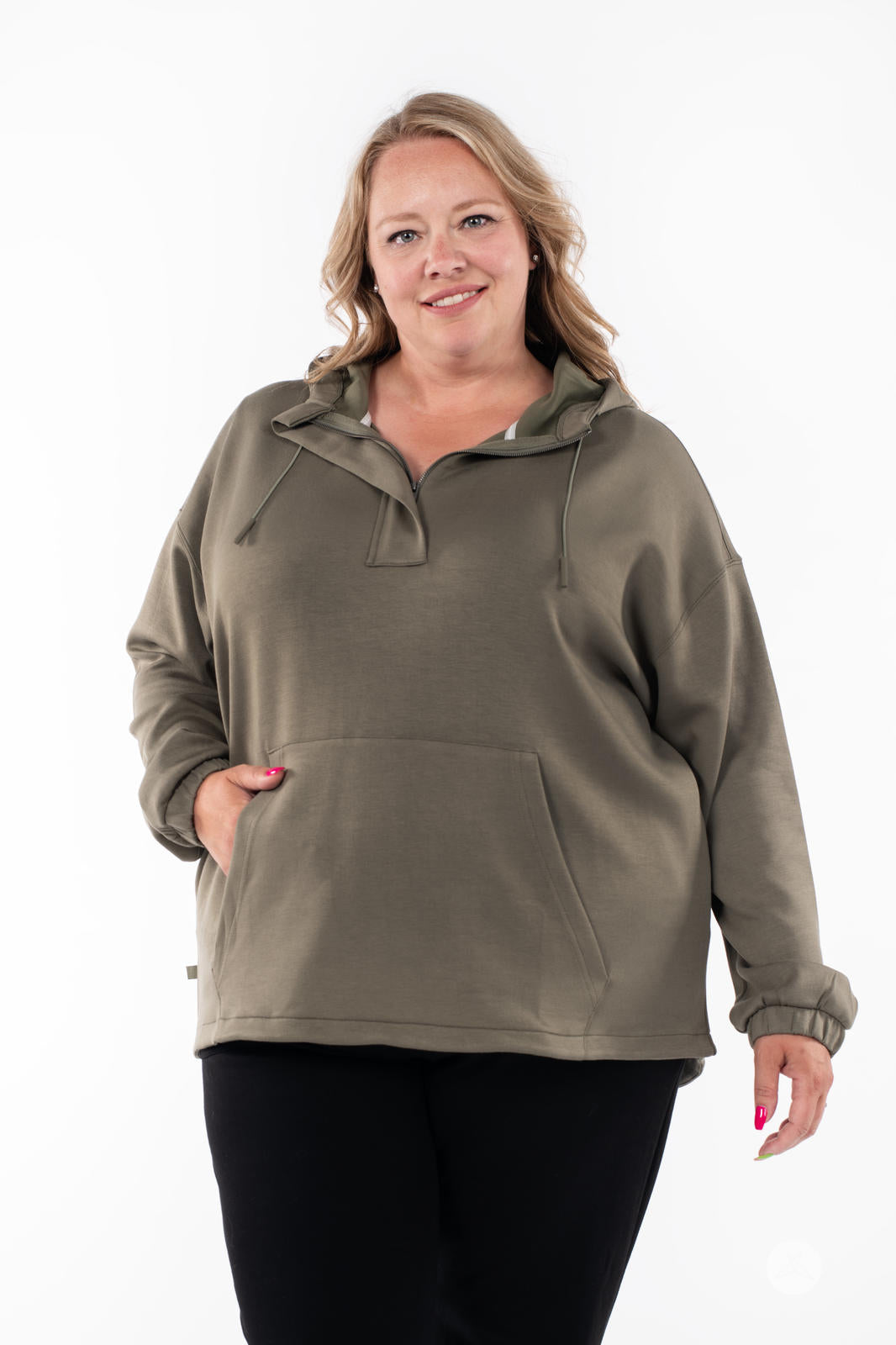 Plus-size model wearing SweetTops All Day Hoodie in olive with front pocket and relaxed fit on white background