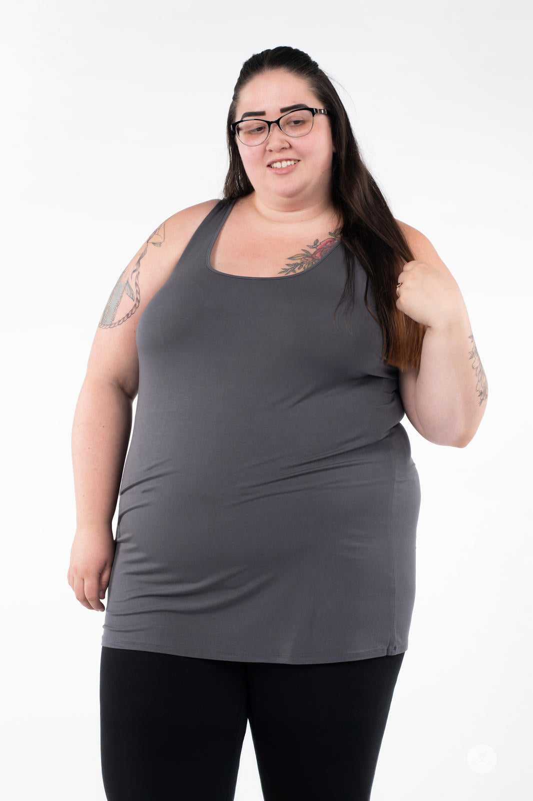 Plus-size model wearing SweetLegs Canada Classic Layering Tank in grey with black pants on white background