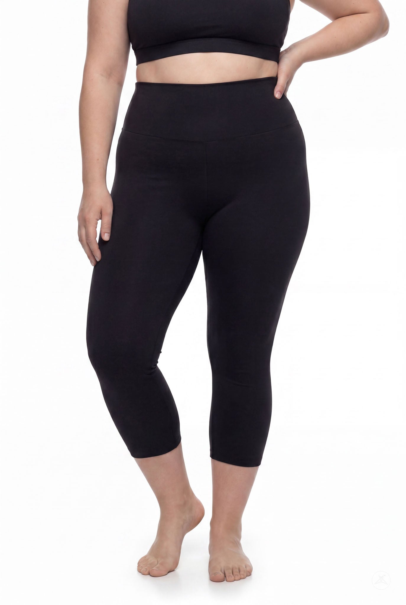 Plus size woman modeling SweetLegs Black High-Waisted Crops with smooth high-rise waistband barefoot front view