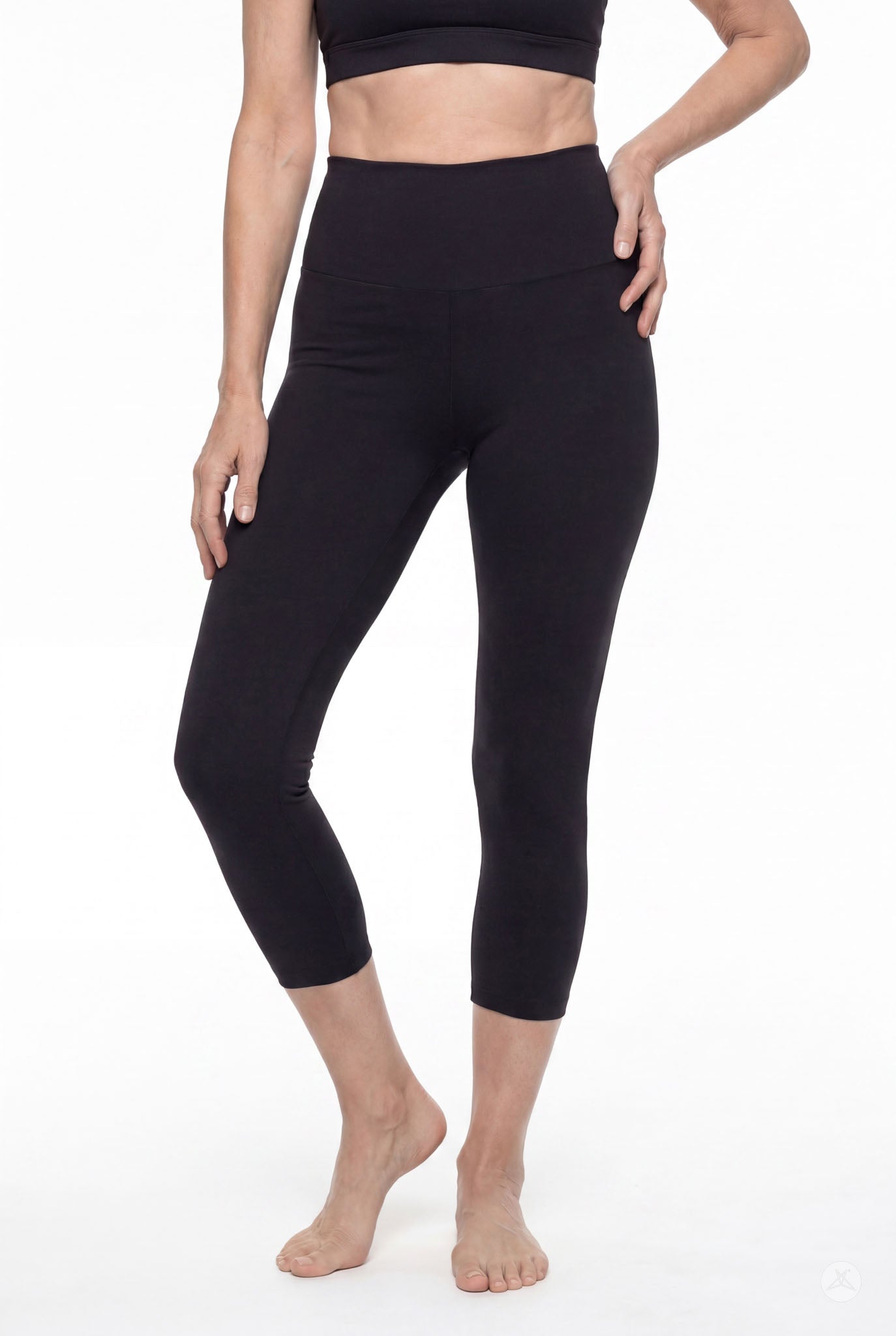 Woman wearing SweetLegs Black High-Waisted Crops with a smooth high-rise waistband and cropped length front view barefoot