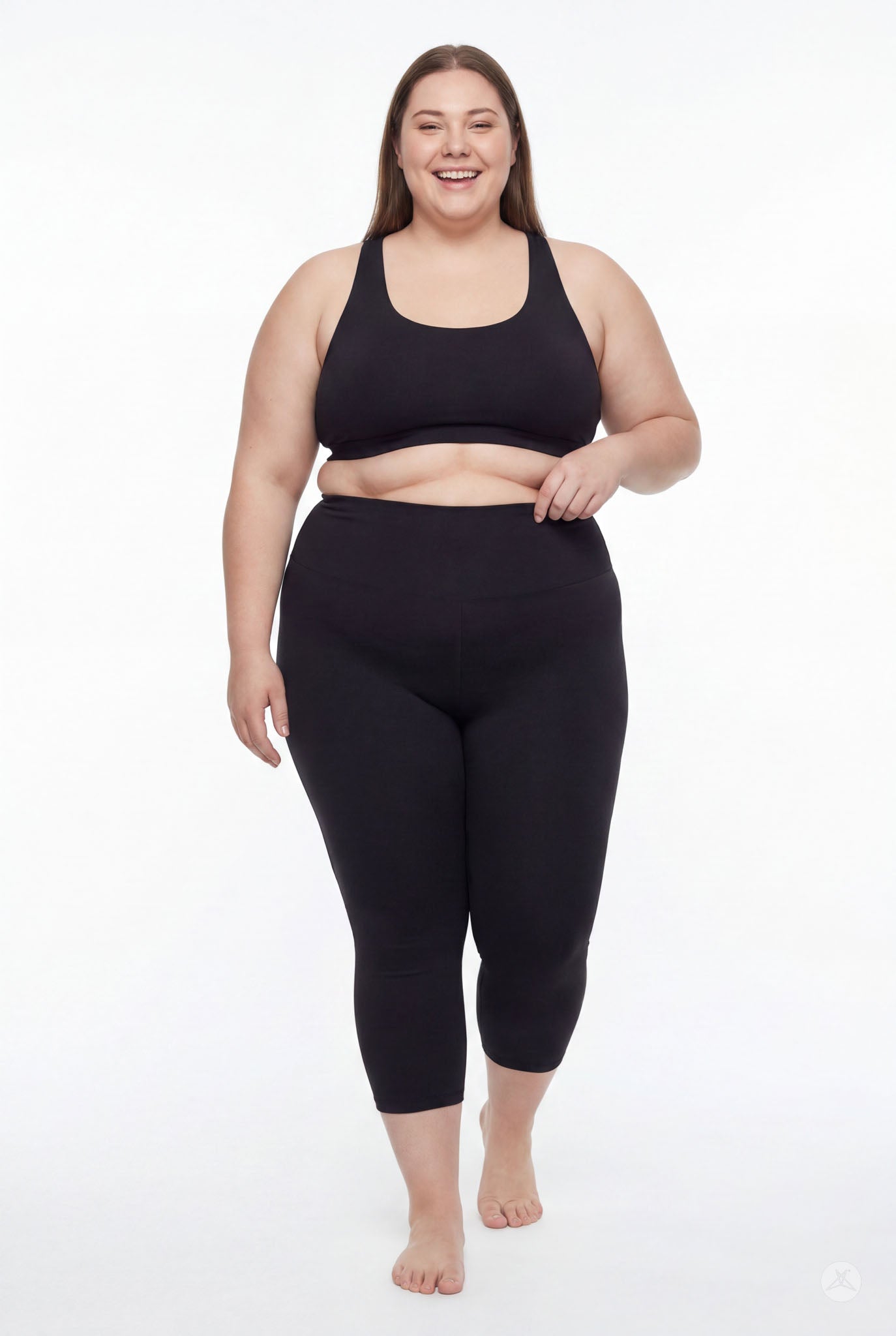 Plus size woman smiling wearing SweetLegs Black High-Waisted Crops with smooth fabric and high-rise waistband front view barefoot