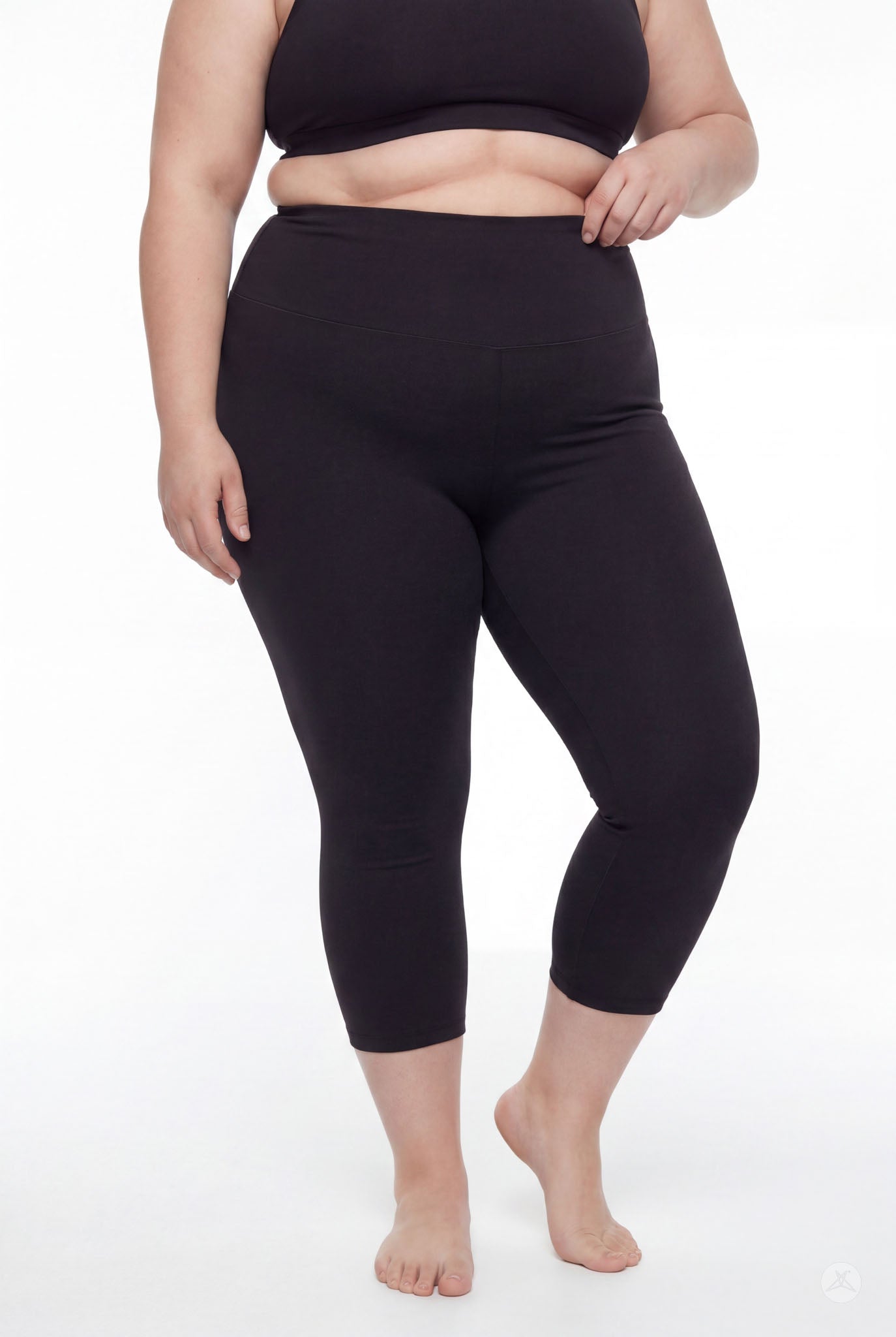 Plus size woman wearing SweetLegs Black High-Waisted Crops with smooth fitted fabric and wide waistband front view barefoot