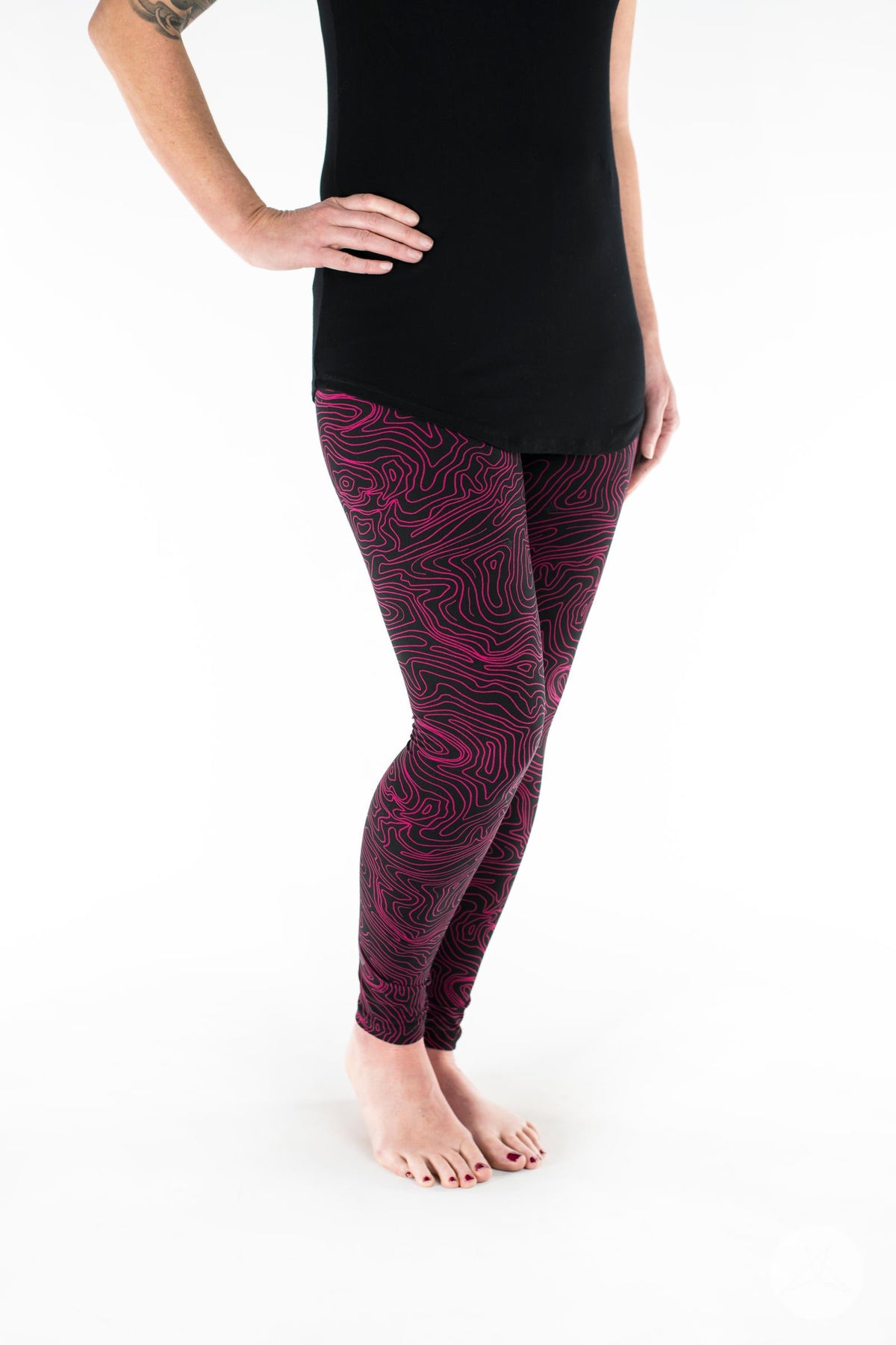 SweetLegs Vault - Signature Leggings with black and magenta contour pattern modeled with a black tunic