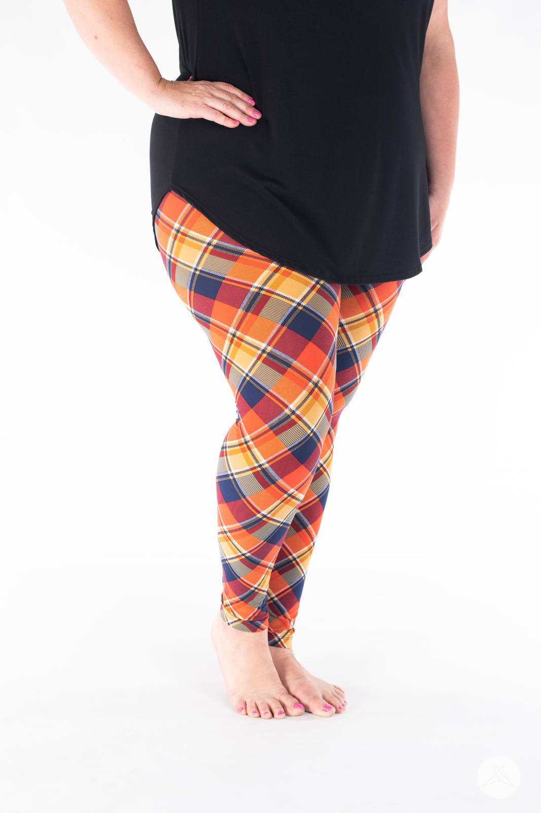 SweetLegs Vault - Signature Leggings in orange navy and white plaid modeled with a black tunic