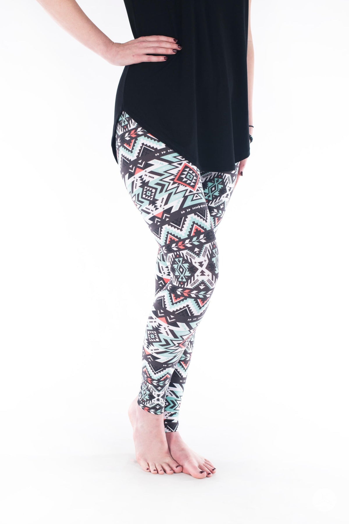 SweetLegs Vault - Signature Leggings with black white and red geometric pattern modeled with a black tunic