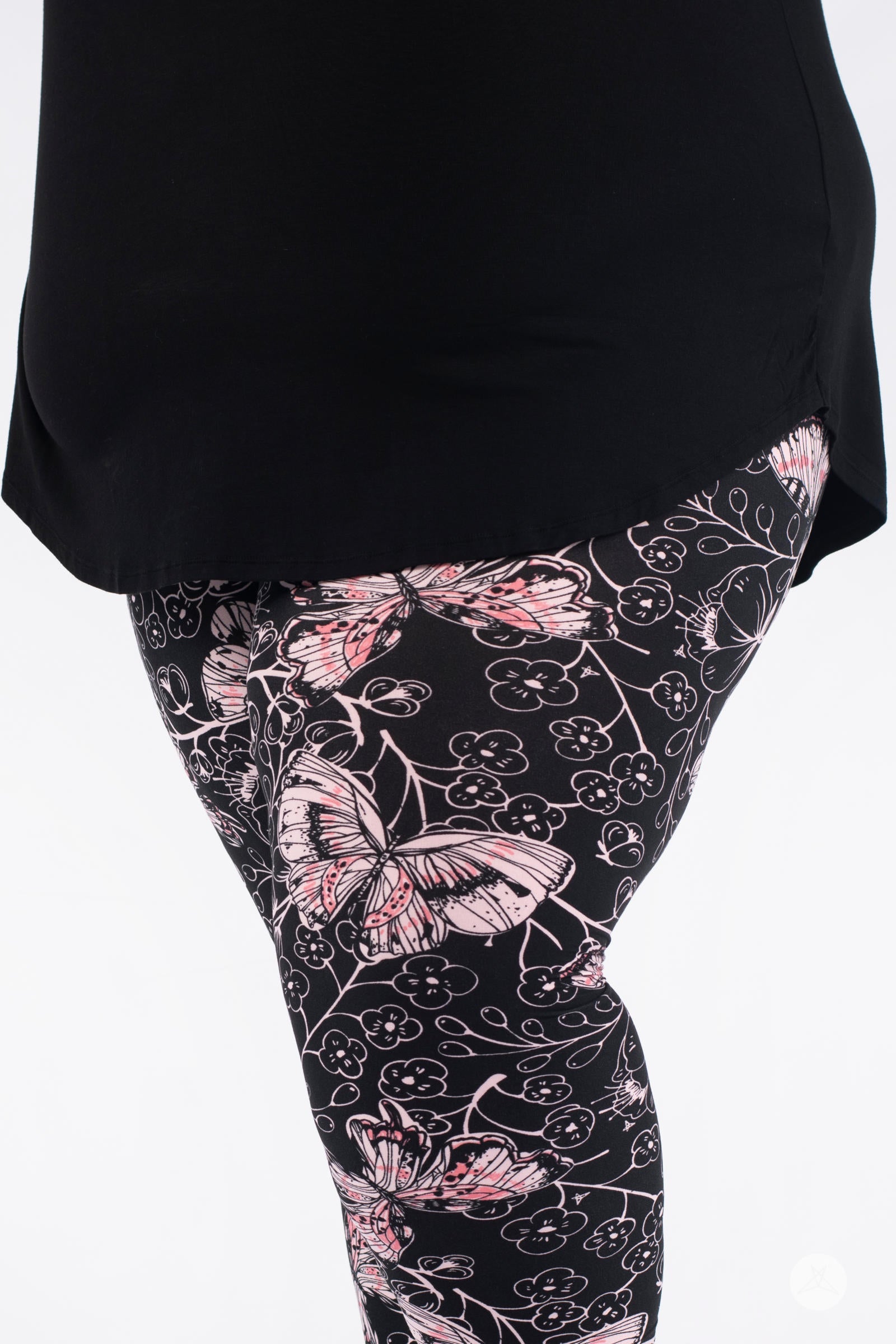 Close-up of SweetLegs Butterfly Bliss 2.0 Crops with pink butterfly and floral design under black top