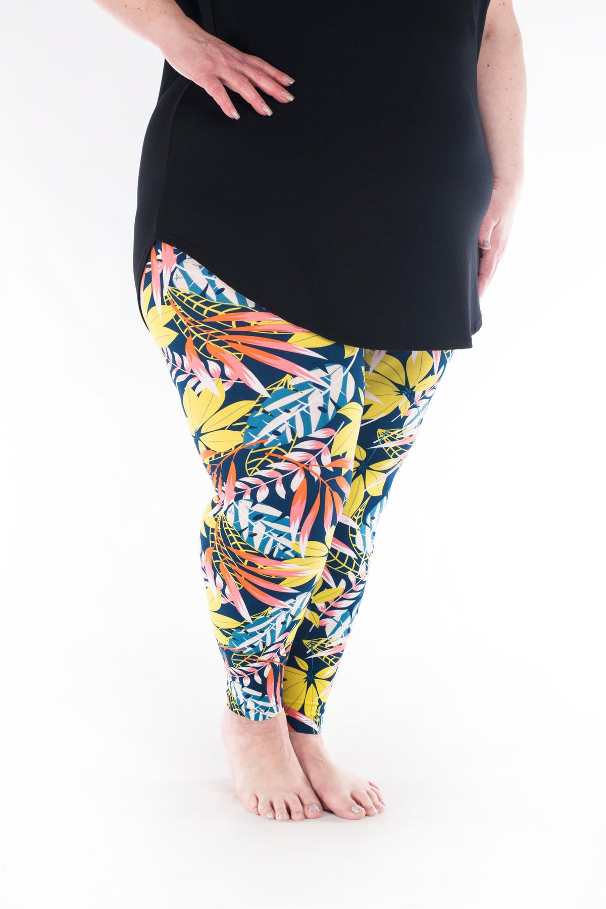 SweetLegs Vault - Signature Leggings with colorful tropical leaf pattern modeled with a black tunic