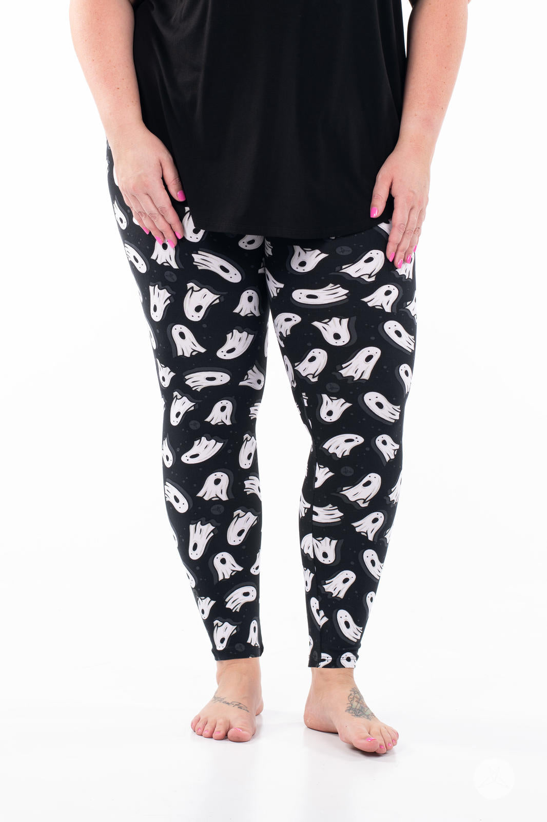 SweetLegs You've Been Ghosted Leggings with a black and white ghost pattern modeled on a person
