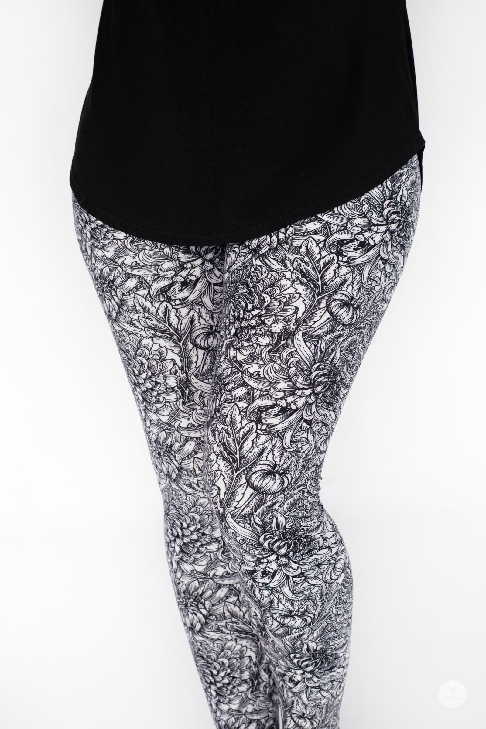 Close-up of SweetLegs Sketchbook leggings featuring large-scale floral sketch pattern in white, grey, and black tones