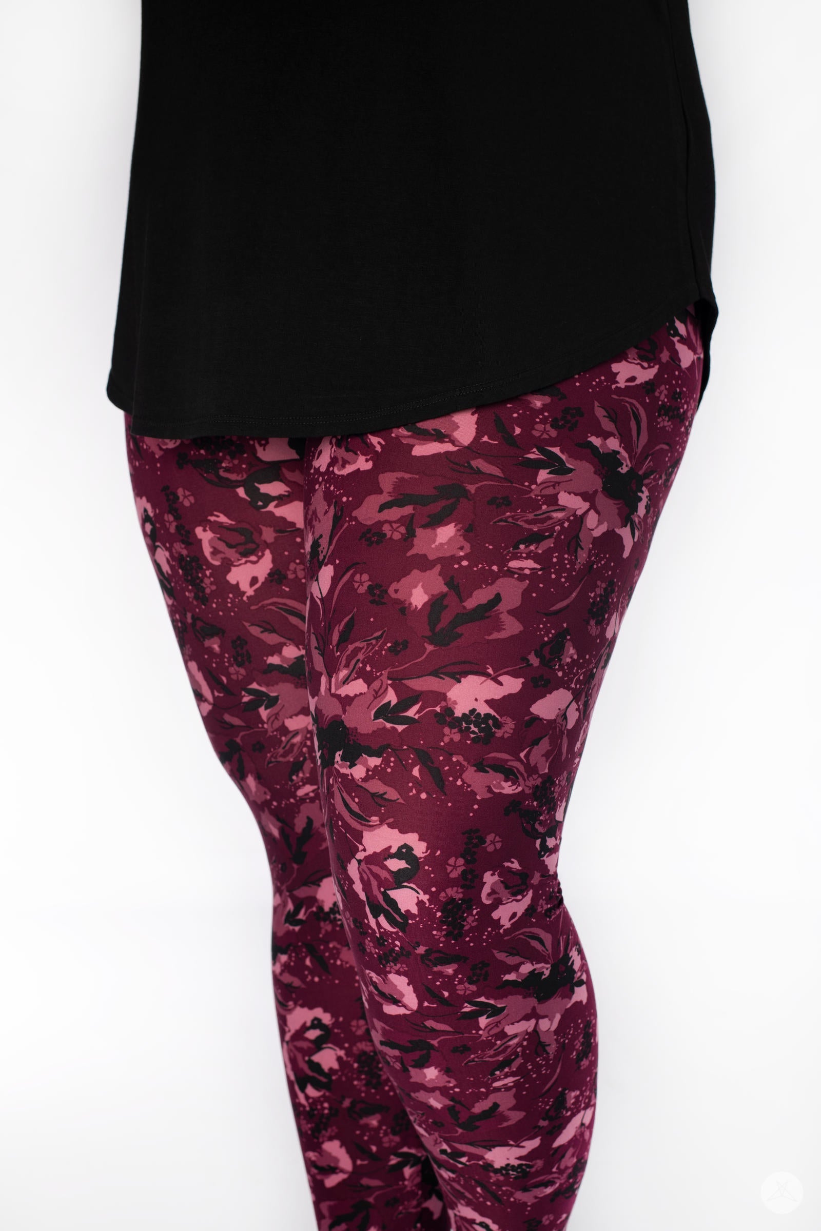 Close-up of SweetLegs Merlot Dreams leggings with hand drawn floral print in shades of mulberry and blush on maroon base