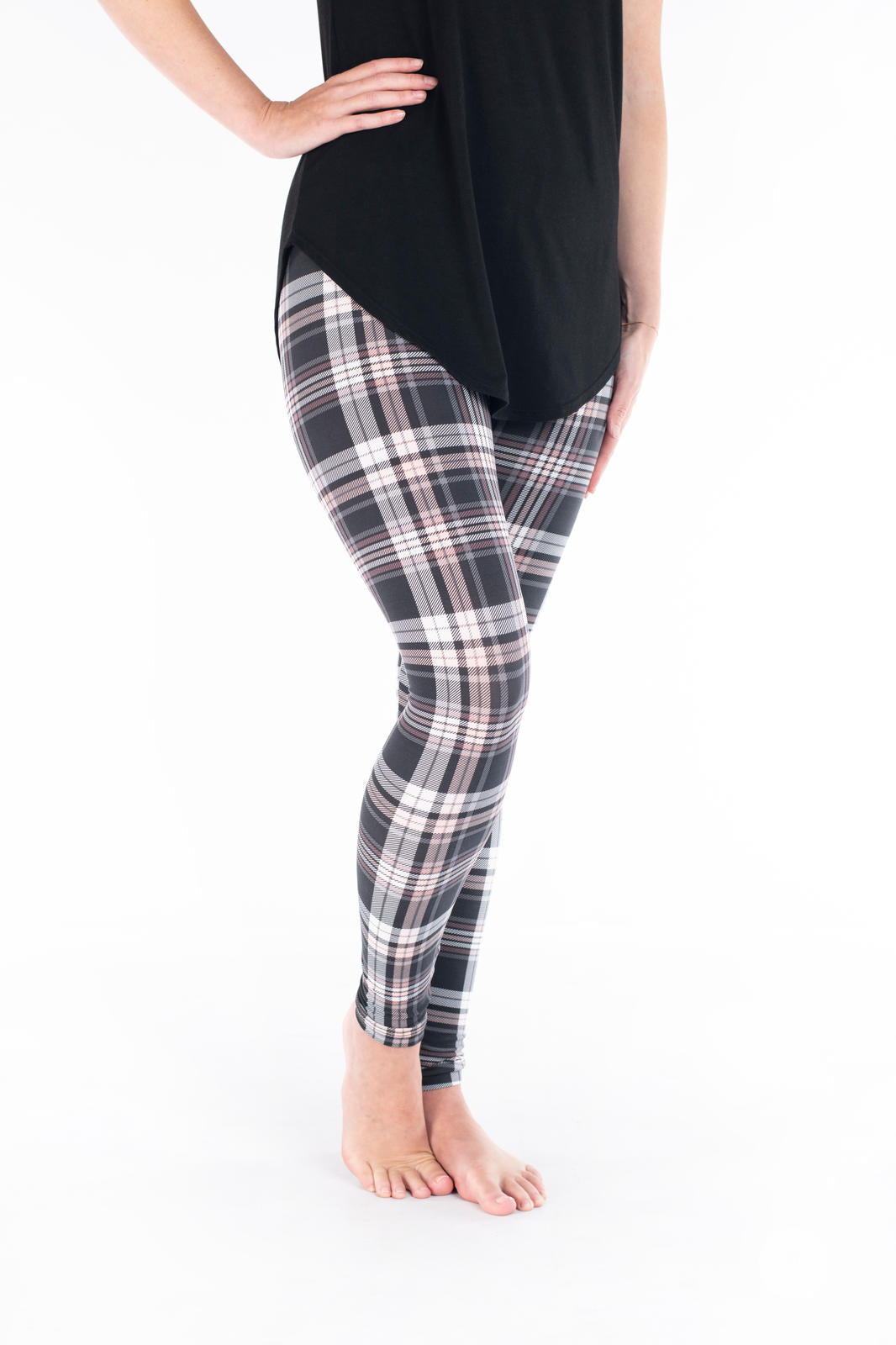 SweetLegs Vault - Signature Leggings featuring gray white and black plaid worn with a black tunic