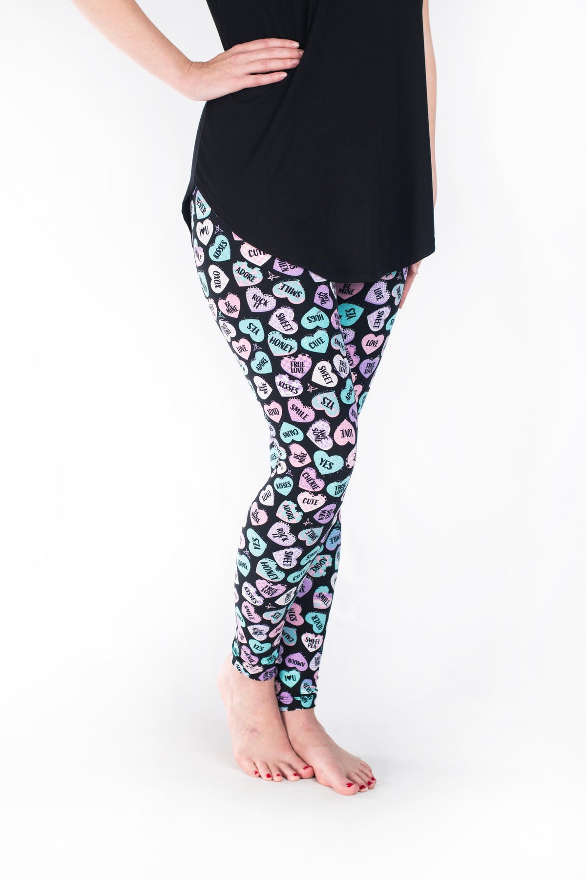 SweetLegs Vault - Signature Leggings in pastel heart print modeled with a black tunic