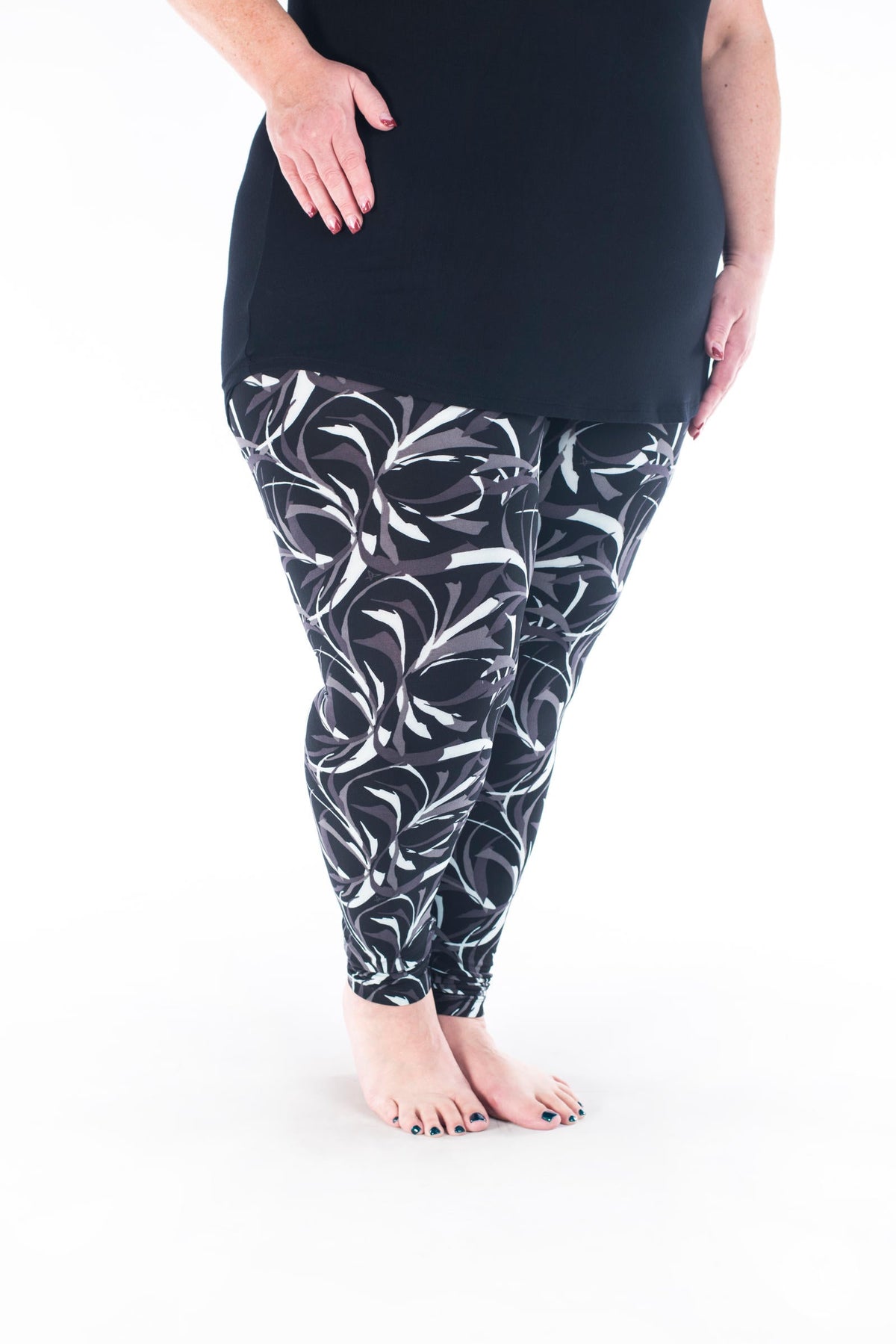 SweetLegs Vault - Signature Leggings with black white and mauve leaf pattern modeled with a black tunic