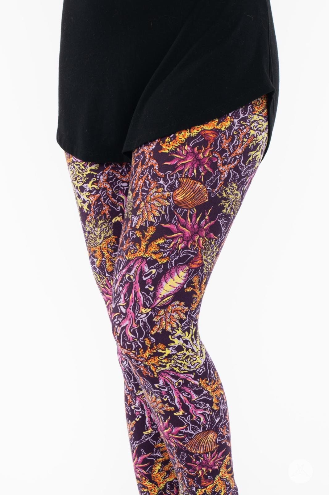 Side view of SweetLegs Coral Cove Crops showcasing vibrant ocean-inspired pattern with comfortable cropped fit above ankle