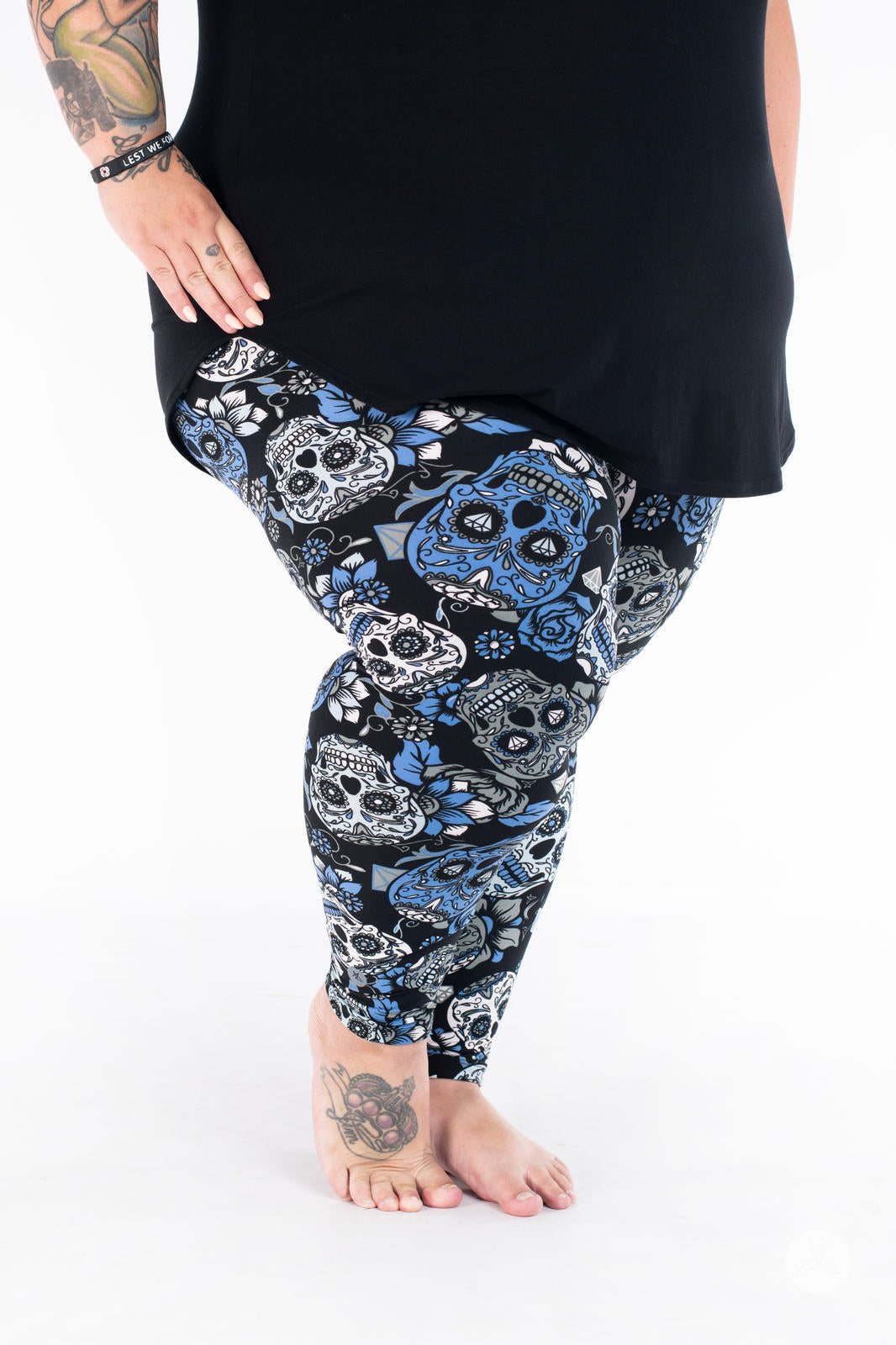 SweetLegs Vault - Signature Leggings with blue black and white skull pattern modeled with a black tunic