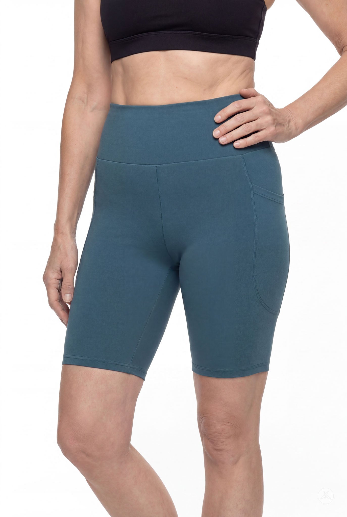 Woman wearing SweetLegs Deep Teal High-Waisted Pocket Biker Shorts with side pocket and elastic waistband detail