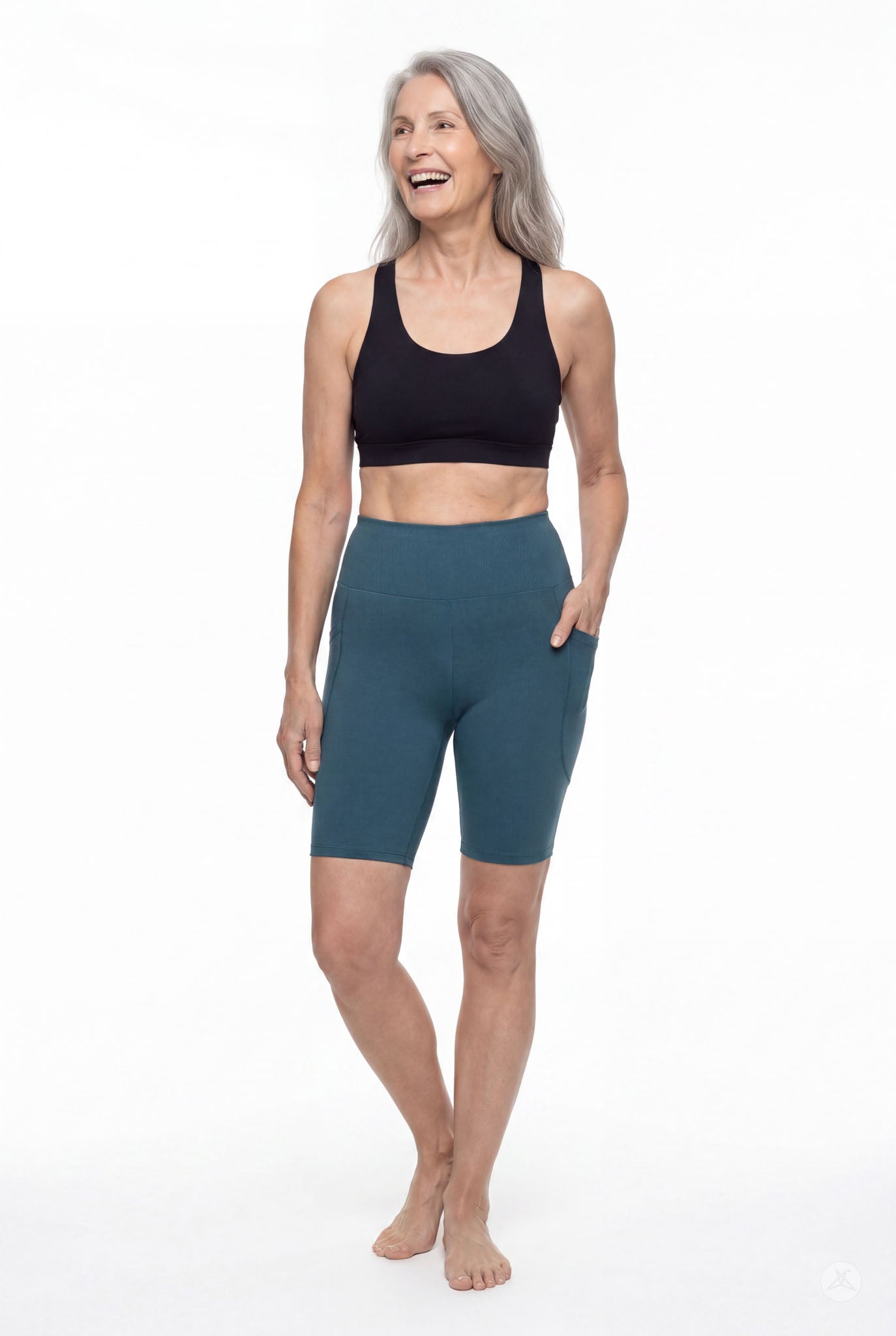 Woman wearing SweetLegs Deep Teal High-Waisted Pocket Biker Shorts showing side pocket and waistband details