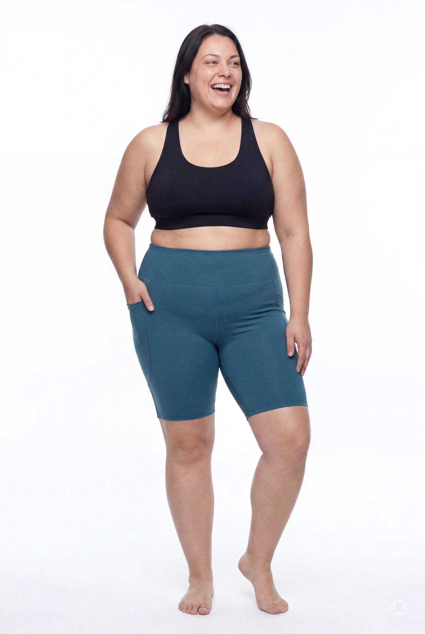 Plus size model wearing SweetLegs Deep Teal High-Waisted Pocket Biker Shorts showing side pocket and elastic waistband detail