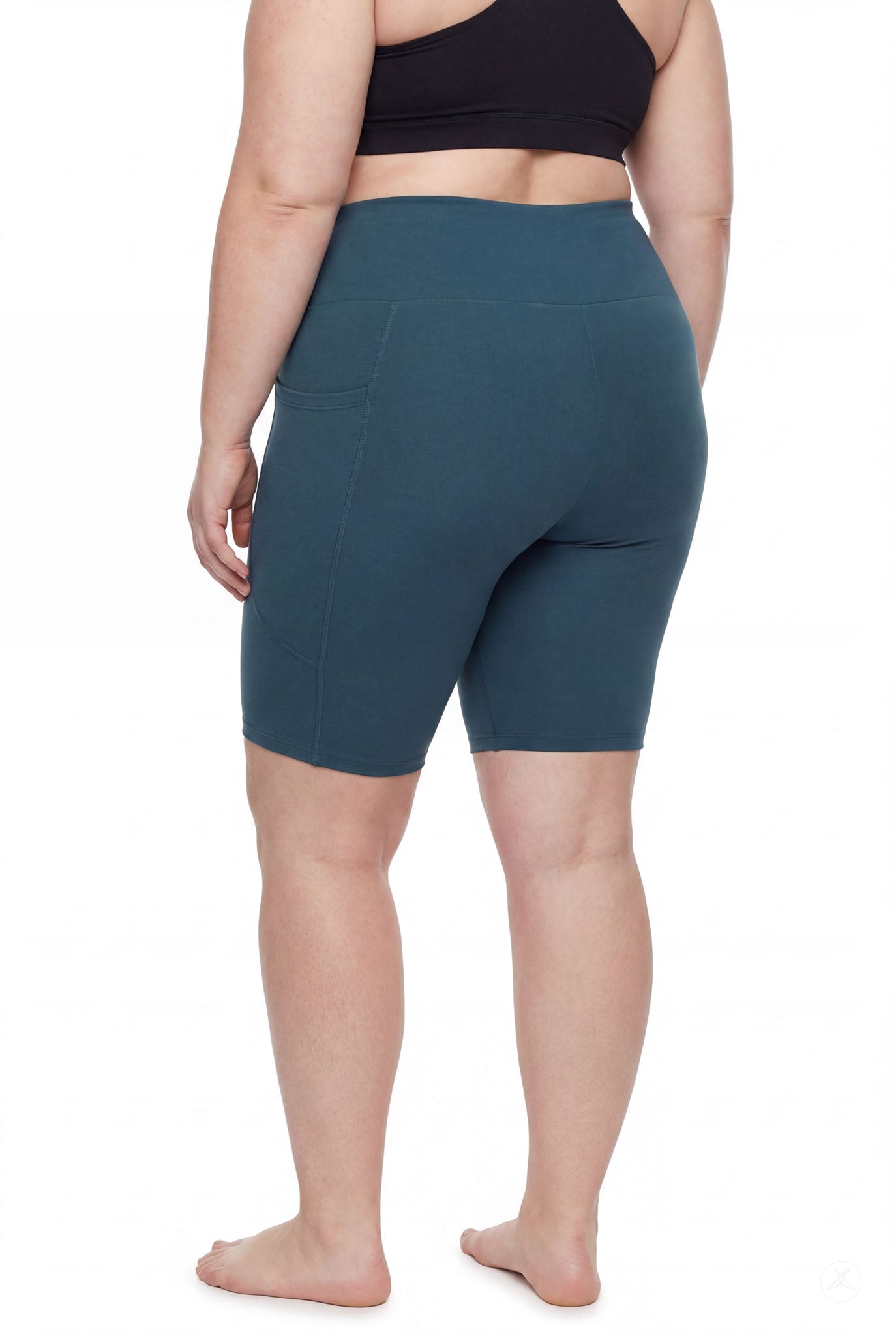 Plus size model wearing SweetLegs Deep Teal High-Waisted Pocket Biker Shorts showing side pocket and smooth waistband from back