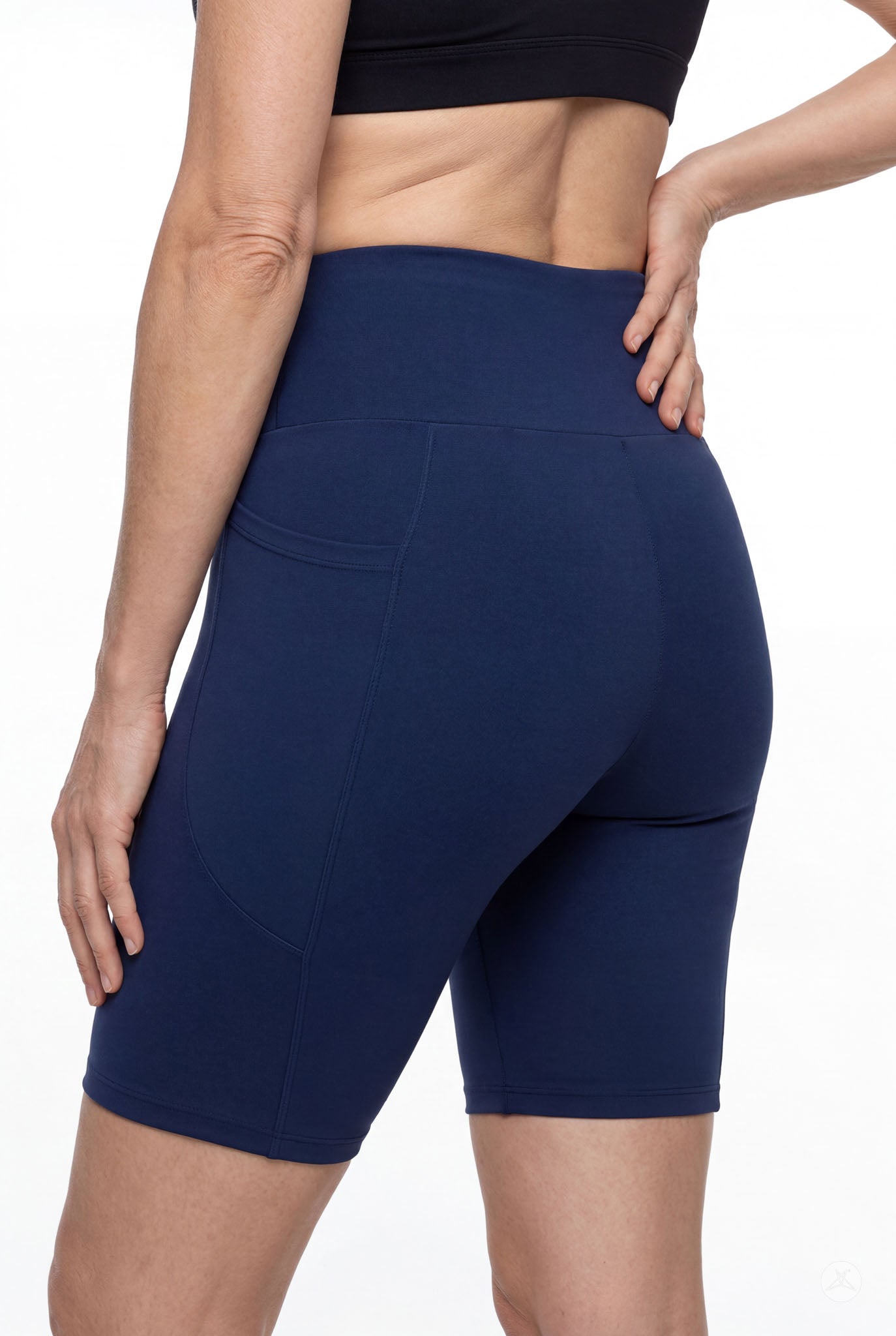 Woman wearing navy Still Water High-Waisted Pocket Biker Shorts by SweetLegs showing back pocket and waistband details