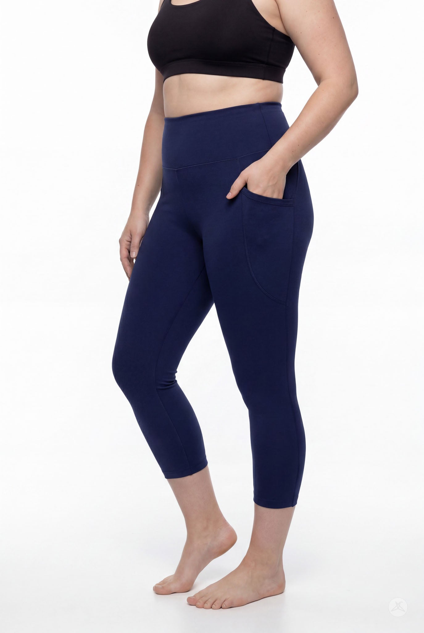 Woman wearing SweetLegs Still Water High-Waisted Pocket Crops in navy with side pocket barefoot side view