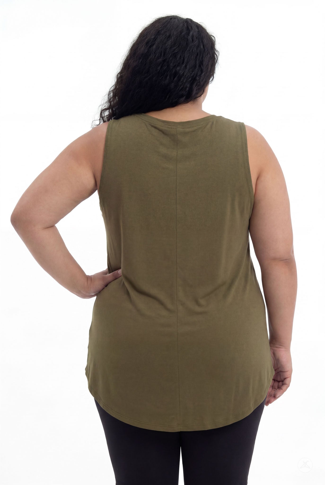 Plus size model seen from behind wearing olive High Neck Swing Tank by SweetTops paired with black leggings on white background
