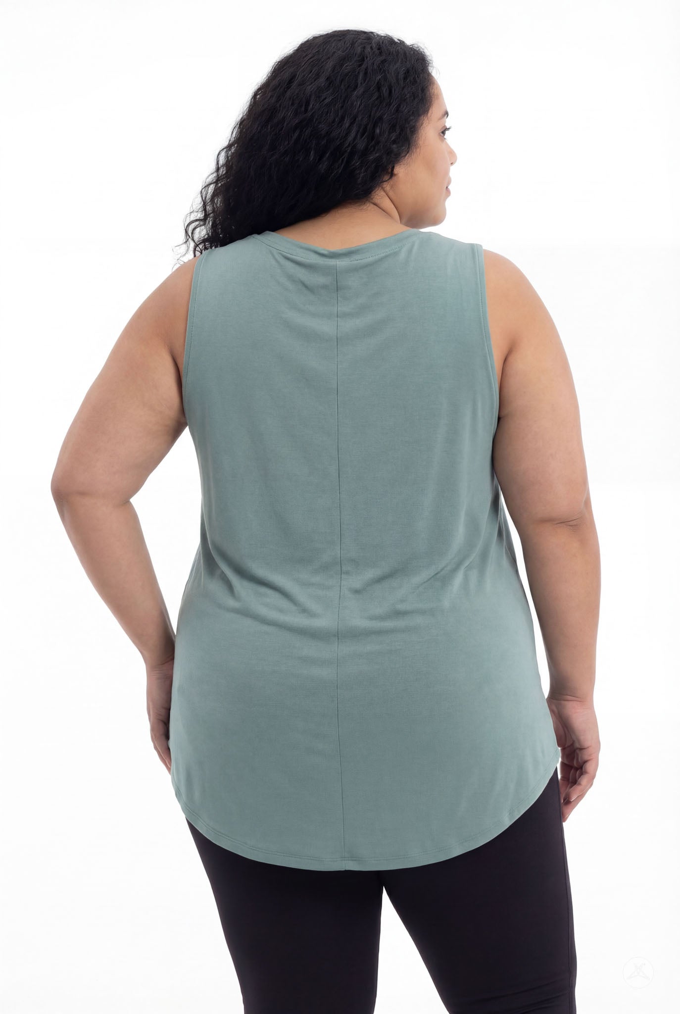 Plus size woman wearing SweetTops High Neck Swing Tank in muted sage with sleeveless relaxed fit from back view