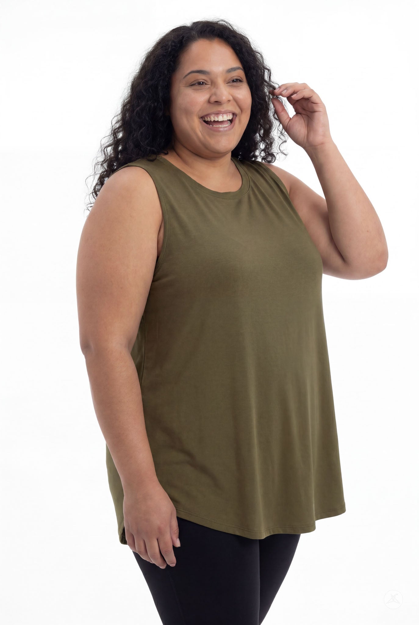 Smiling plus size model wearing olive High Neck Swing Tank by SweetTops with black leggings on white background