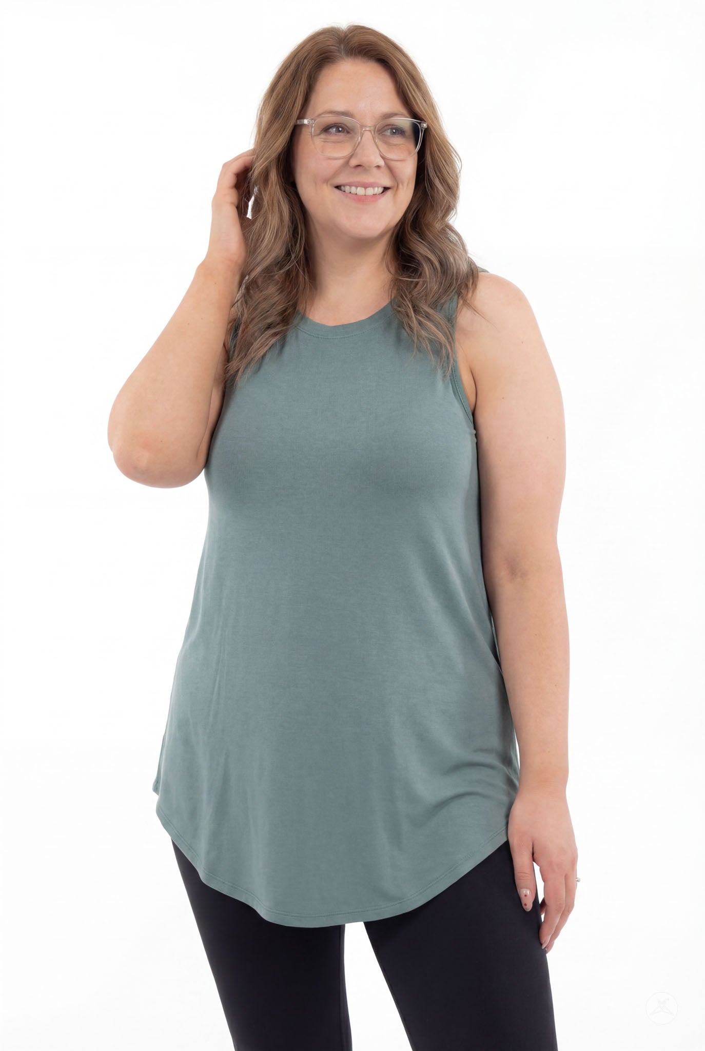 Plus size model wearing SweetTops High Neck Swing Tank in muted green with relaxed fit and sleeveless design