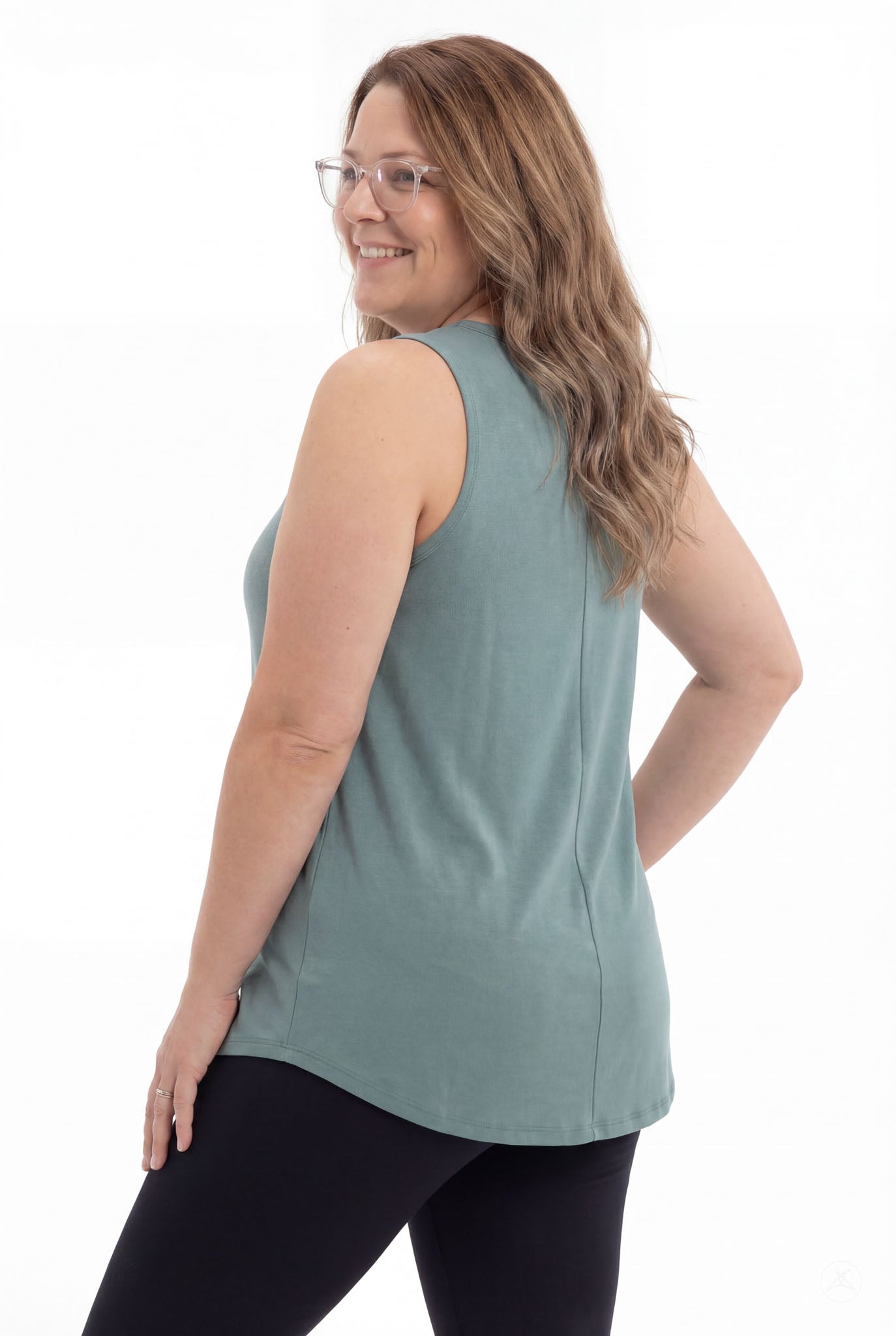 Plus size woman wearing SweetTops High Neck Swing Tank in muted teal with sleeveless design and relaxed fit from back view