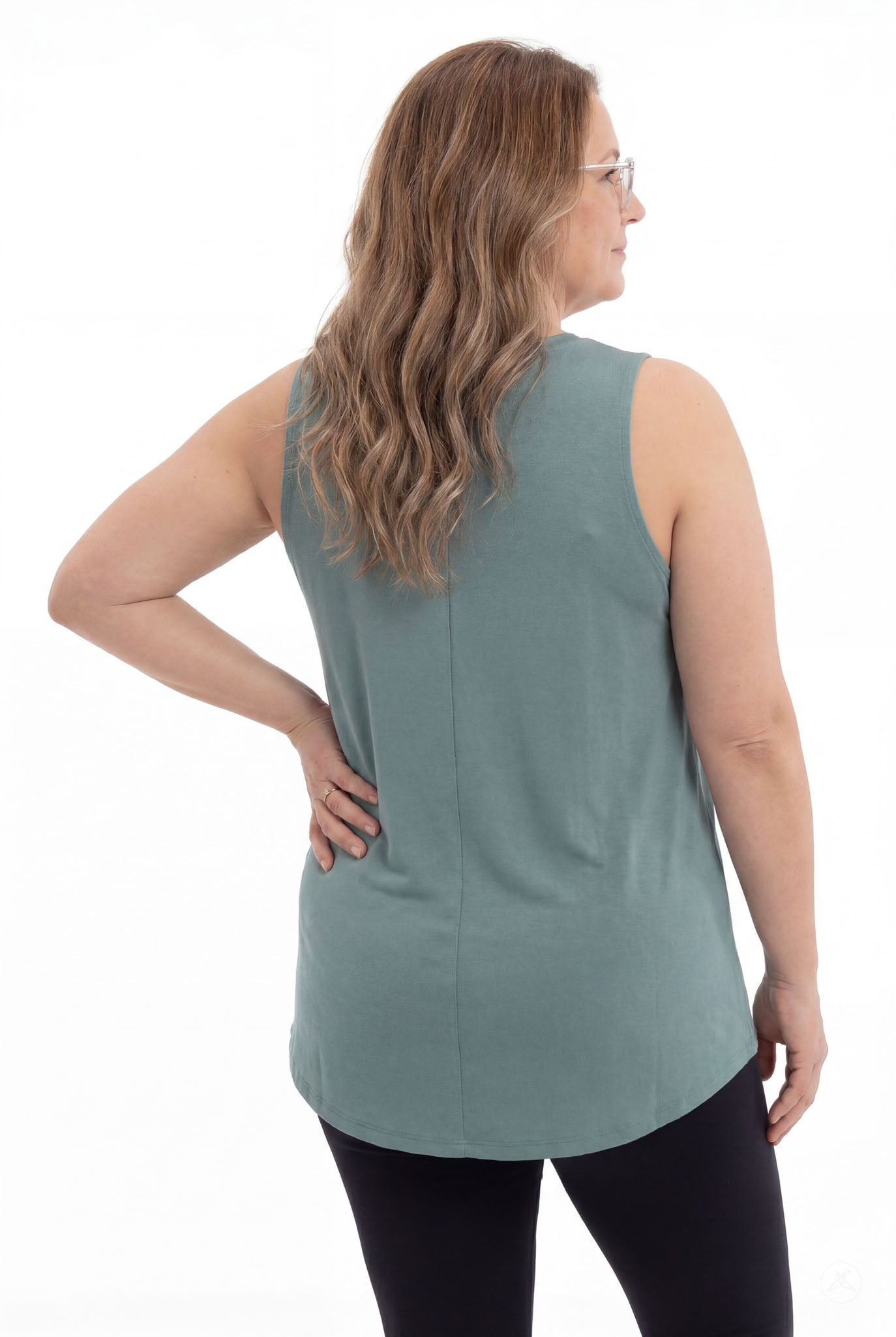 Plus size woman modeling SweetTops High Neck Swing Tank in muted teal with relaxed fit shown from the back