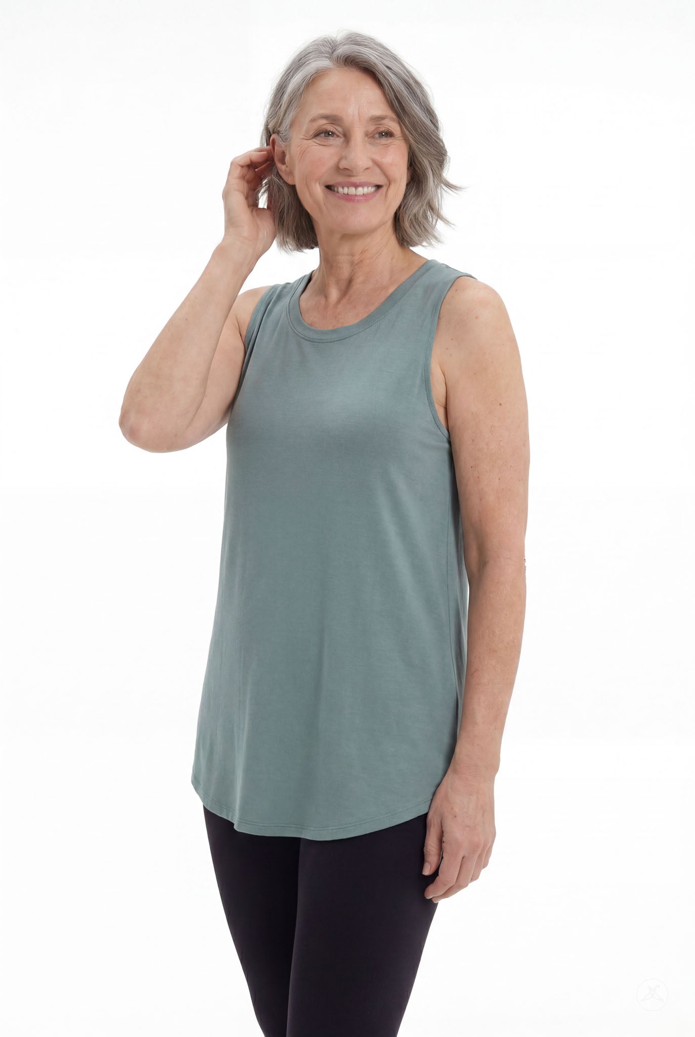 Mature woman wearing SweetTops High Neck Swing Tank in muted green with sleeveless relaxed fit and casual style