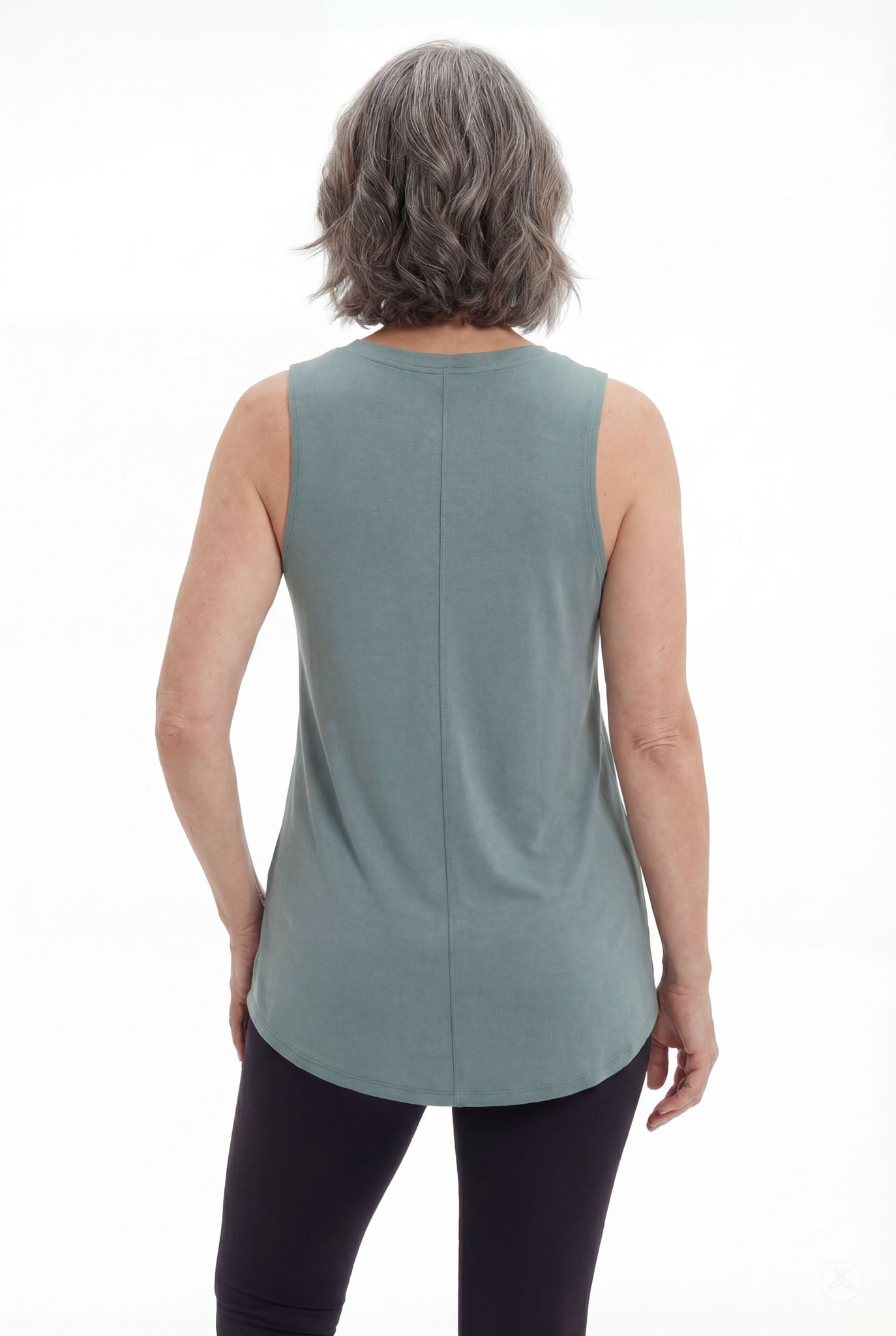 Mature woman modeling SweetTops High Neck Swing Tank in muted blue-gray with sleeveless relaxed fit viewed from back