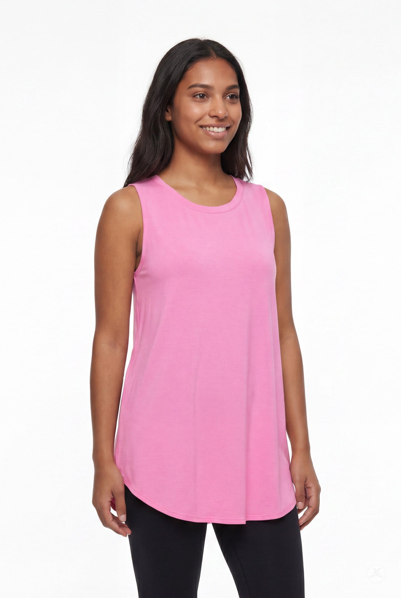 Smiling woman wearing SweetTops High Neck Swing Tank in soft pink with relaxed fit and sleeveless design
