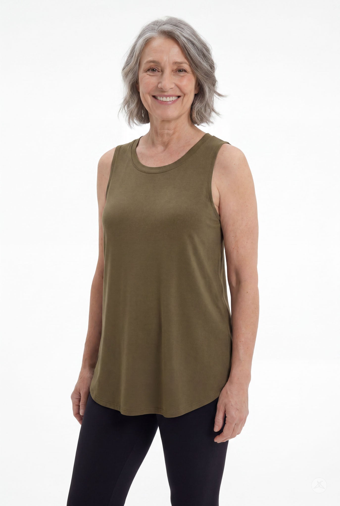 Woman wearing olive High Neck Swing Tank by SweetTops paired with black leggings smiling on white background