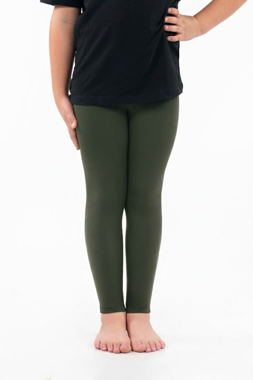 Child wearing SweetLegs Kids Dream Fleece Leggings in olive green with a soft and lightweight comfortable fit
