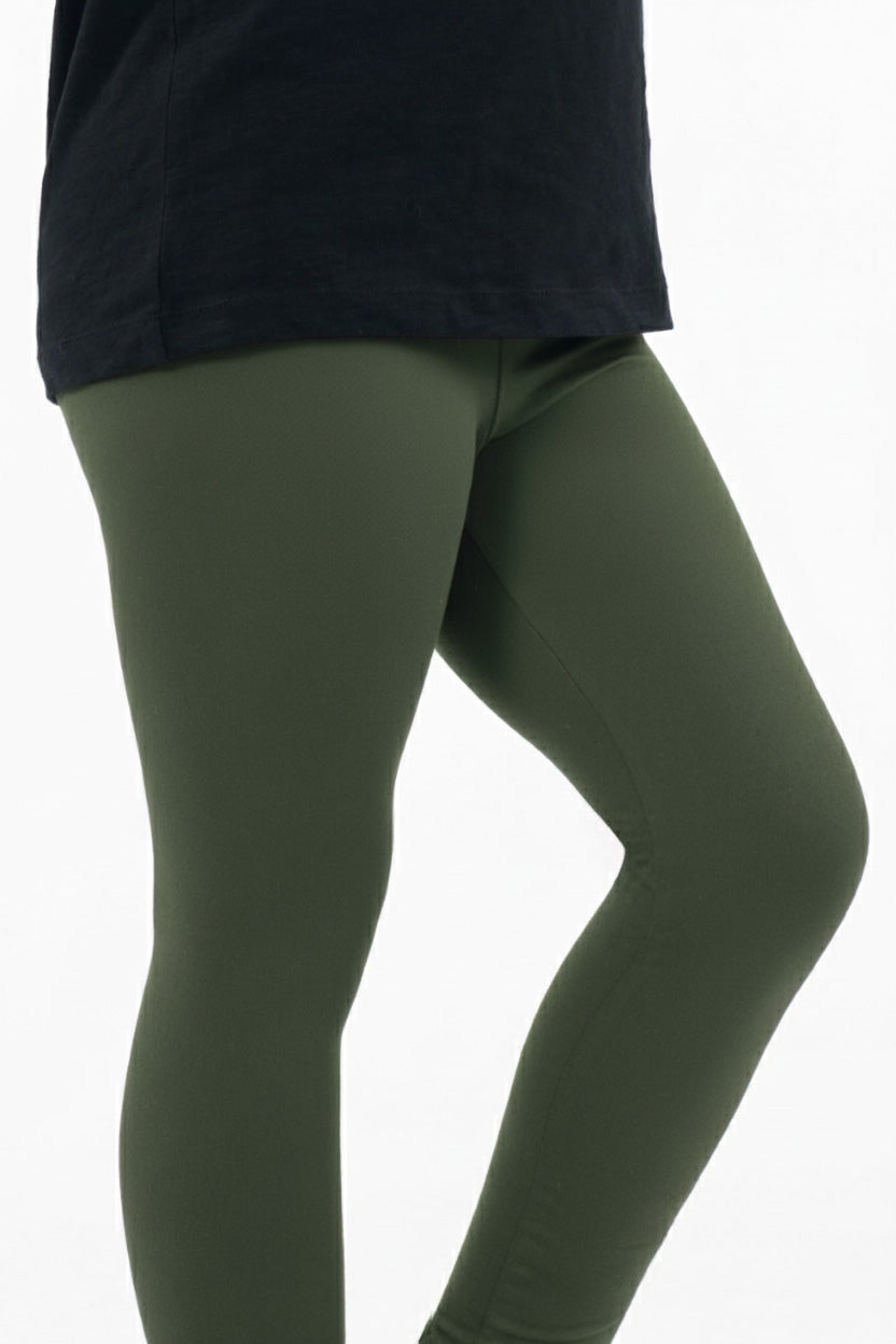 Child wearing SweetLegs Kids Dream Fleece Leggings in olive green with a lightweight, soft, and cozy fit for all seasons