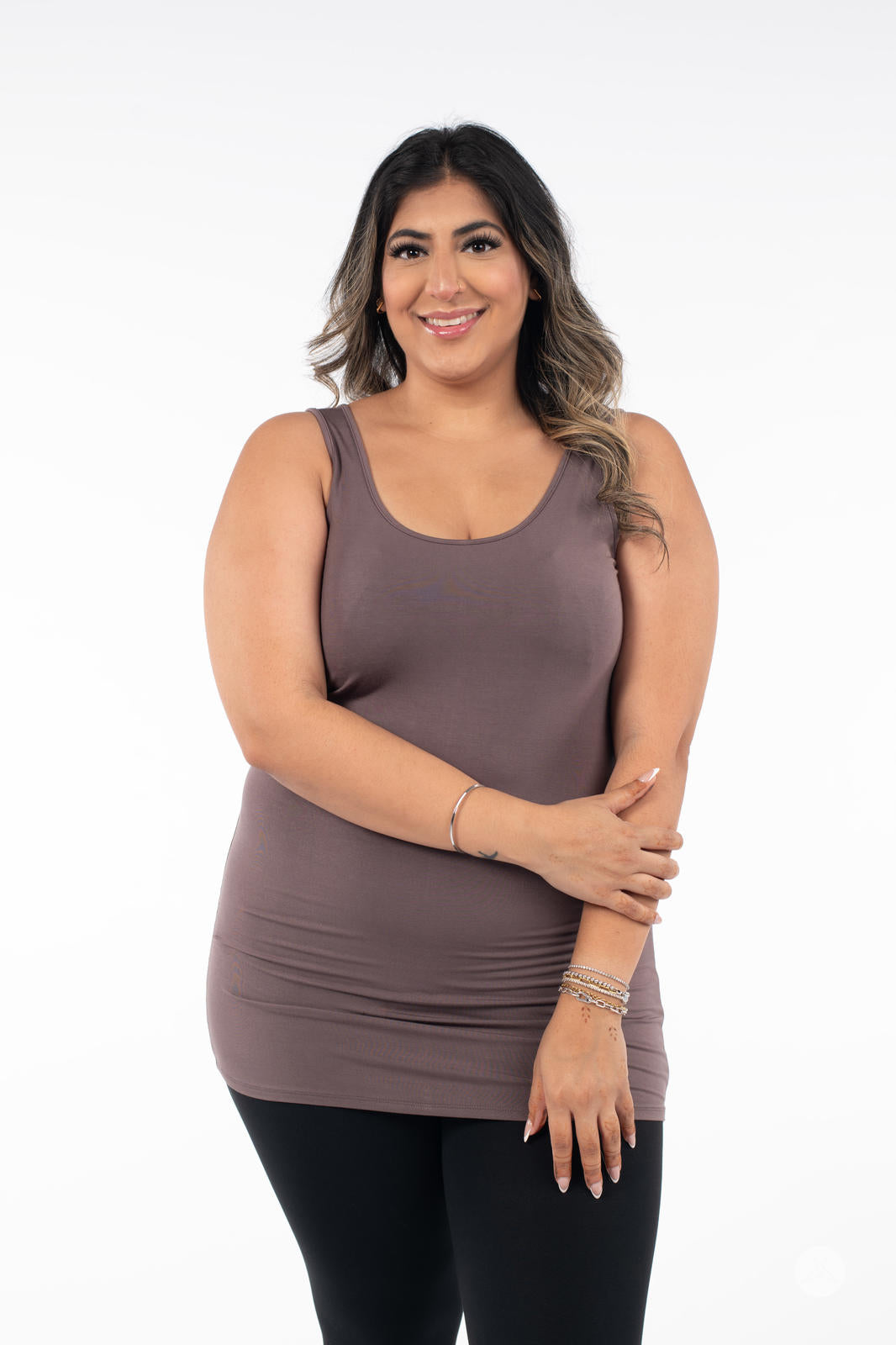 Woman smiling wearing SweetLegs Canada Classic Layering Tank in brown with black leggings on white background