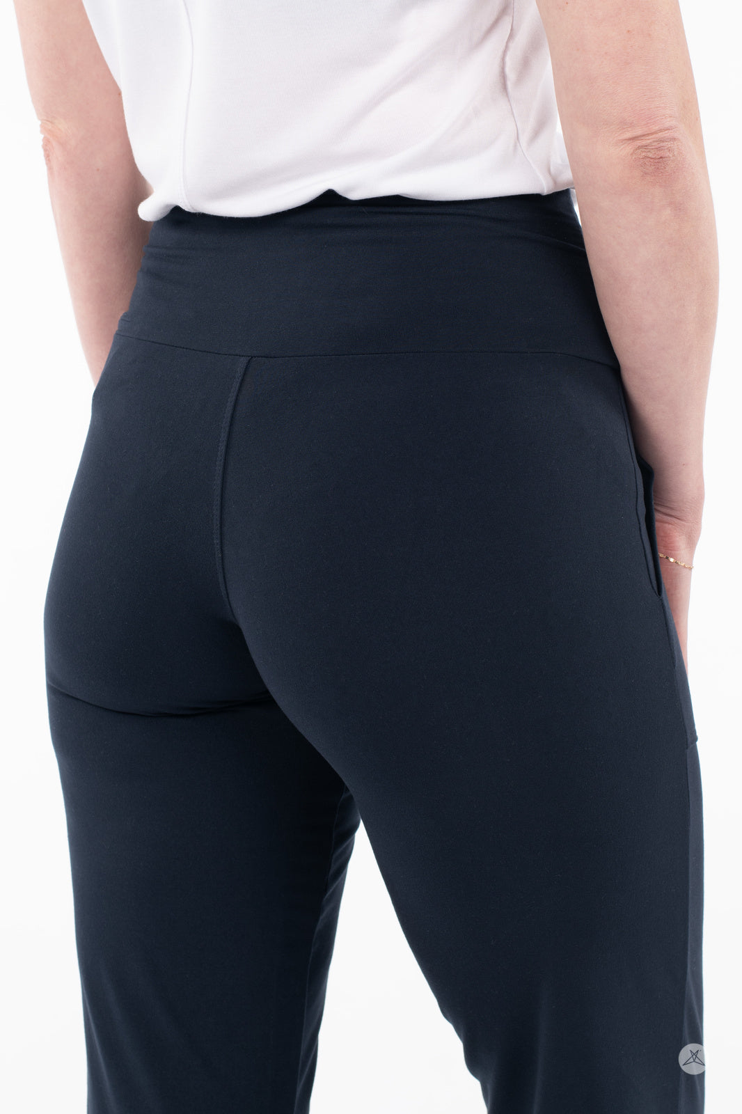 Back view of person wearing SweetLegs High-Waist Wide Leg Crops in black with white top and gold bracelet