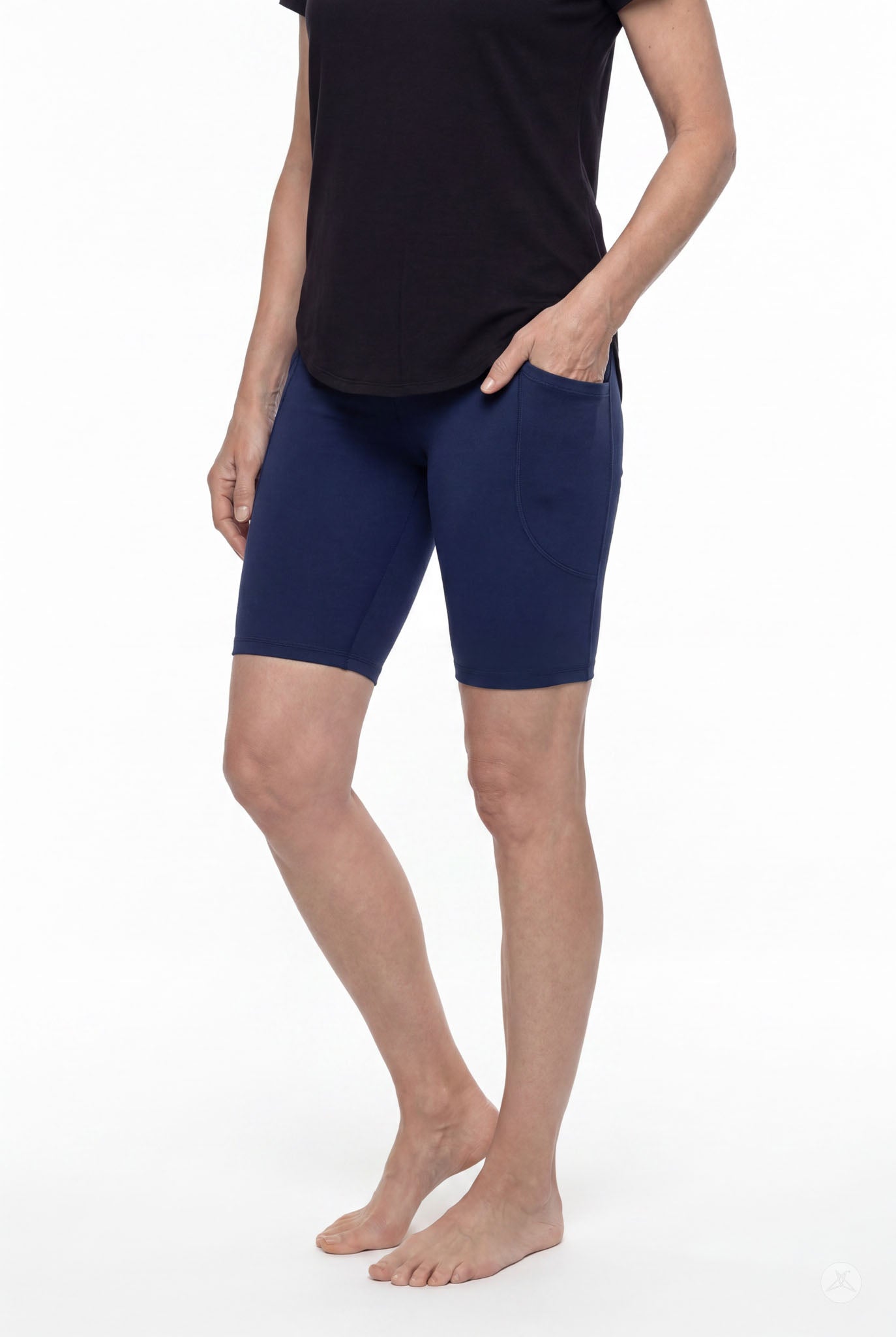 Woman wearing SweetLegs Still Water Pocket Biker Shorts in navy with side pocket and comfortable elastic waistband