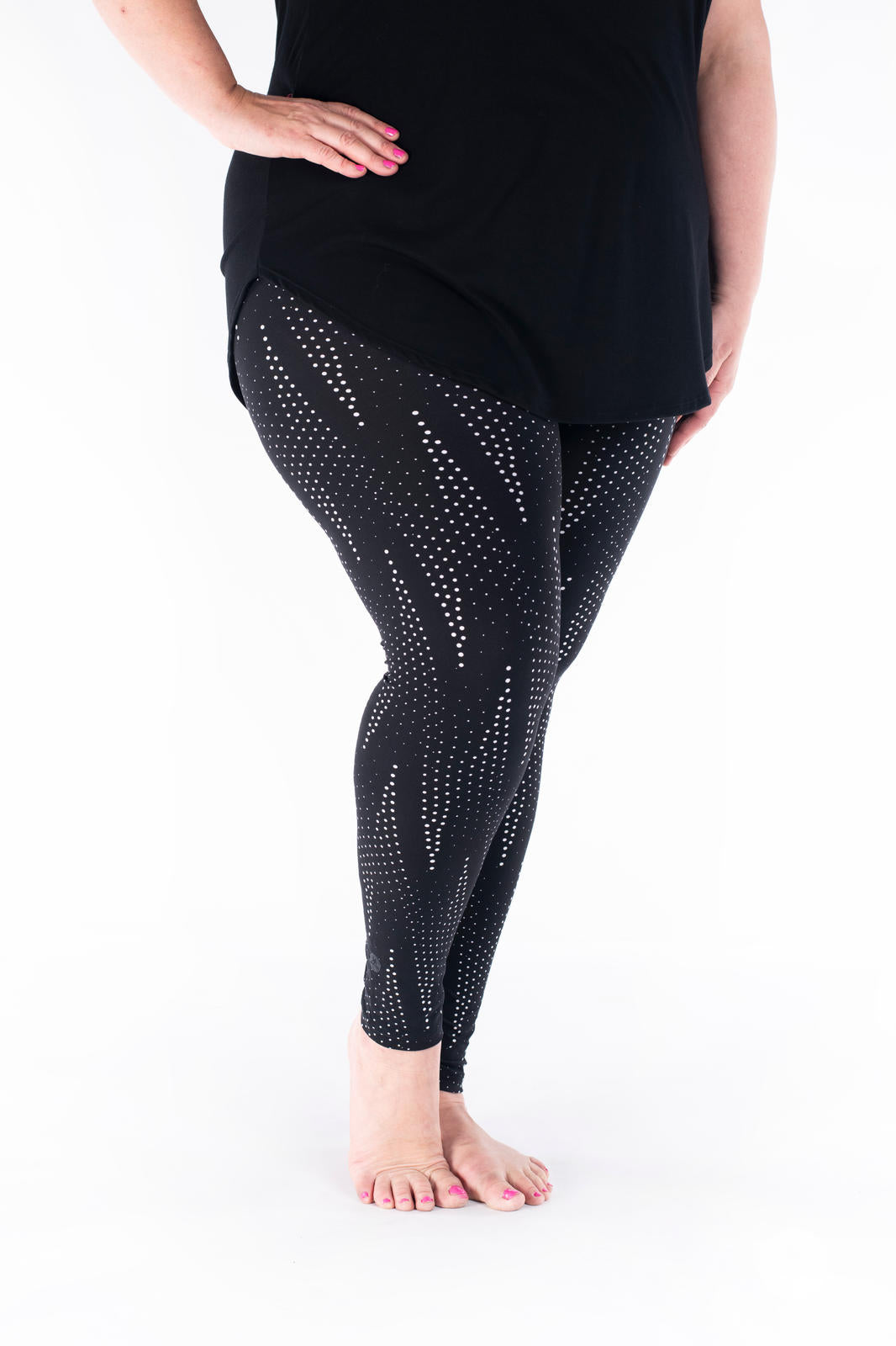 SweetLegs Vault - Signature Leggings in black with white dotted pattern modeled with a black tunic