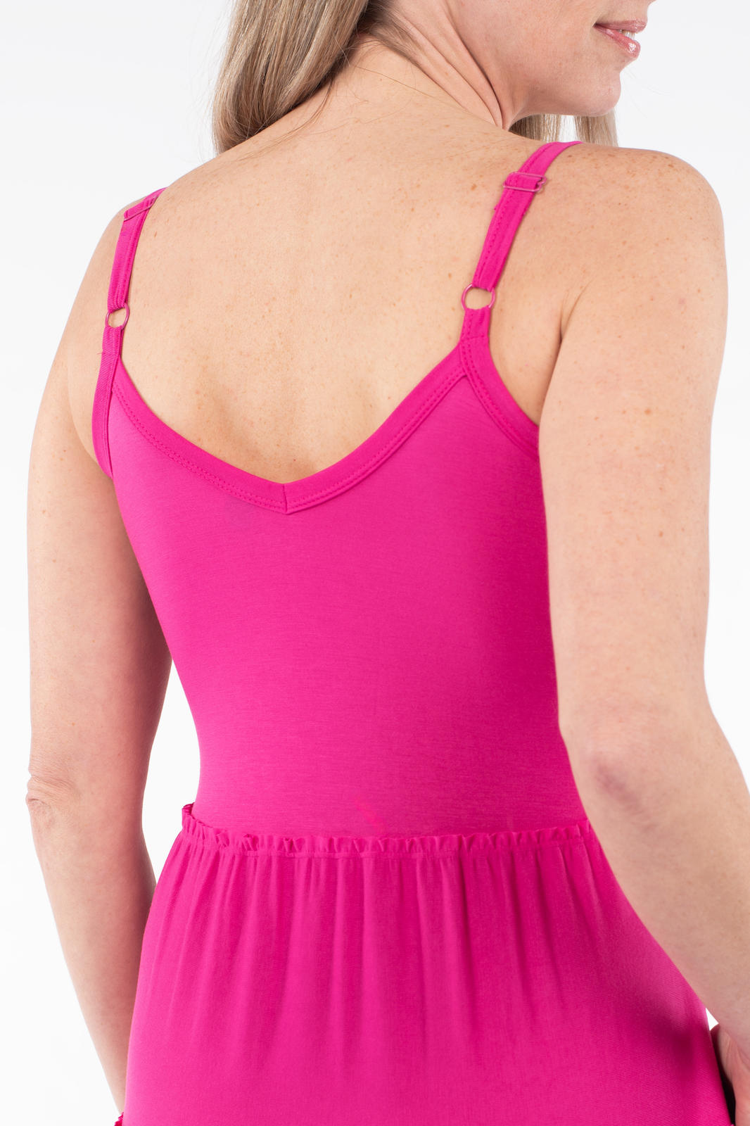 Back view of woman wearing SweetTops The Summer Tiered Dress in bright pink with adjustable straps and gathered waist detail
