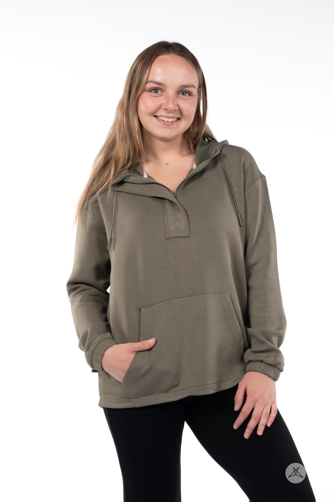 Woman wearing olive SweetTops All Day Hoodie with front pocket and hidden half zip on white background