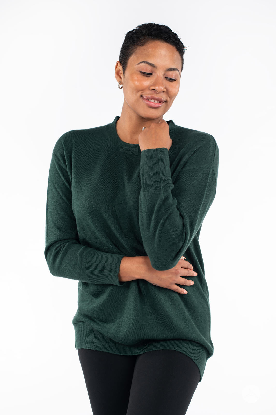 Model wearing SweetTops Soft Knit Crew Neck Sweater in forest green with comfortable relaxed fit and long sleeves front view