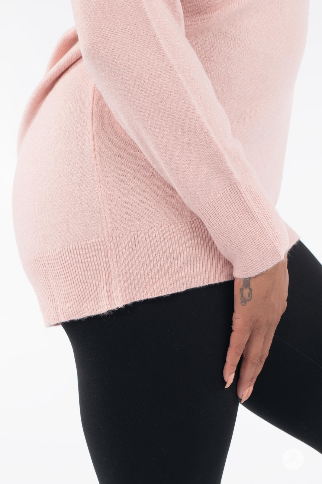 Side view of person wearing SweetTops Soft Knit Crew Neck Sweater in soft pink with ribbed hem and cuffs