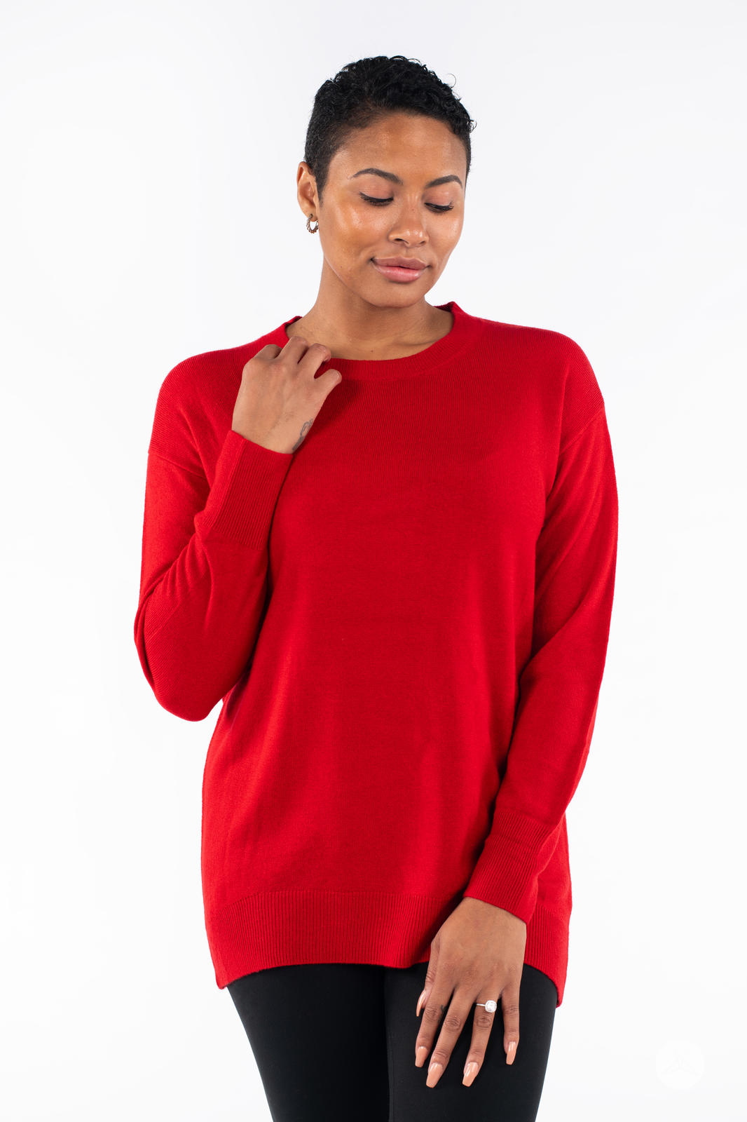 Woman wearing SweetTops Soft Knit Crew Neck Sweater in vibrant red with relaxed fit and long sleeves against white background