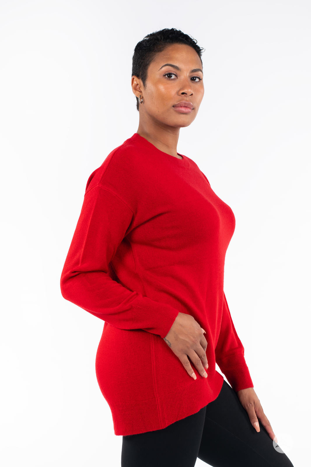 Woman modeling SweetTops Soft Knit Crew Neck Sweater in vibrant red with relaxed fit and long sleeves side view